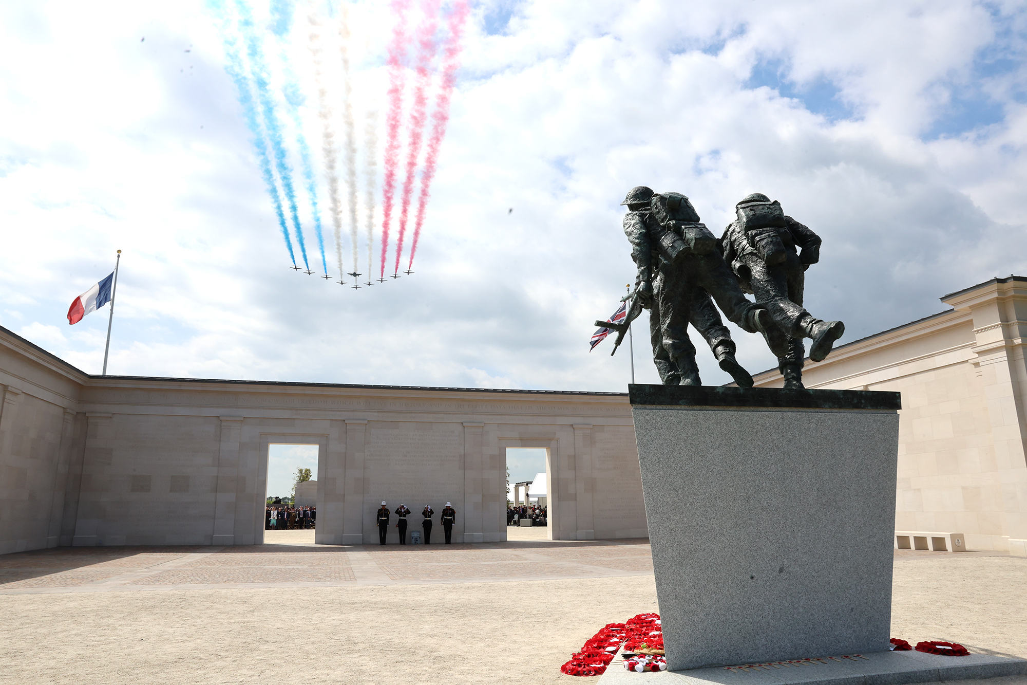 The Red Arrows perform a fly over during the 80th anniversary of D-Day on June 6, in Ver-Sur-Mer, France. 