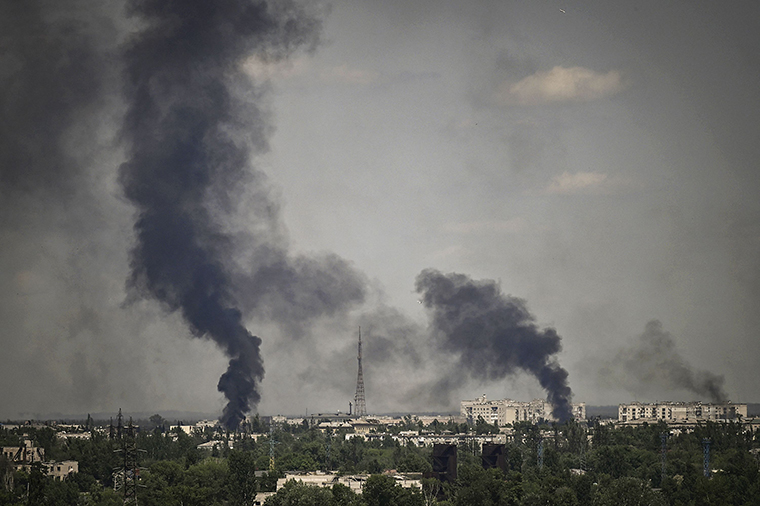 Smoke rises in the city of Severodonetsk during heavy fighting between Ukrainian and Russian forces in the Donbass region of eastern Ukraine on May 30.