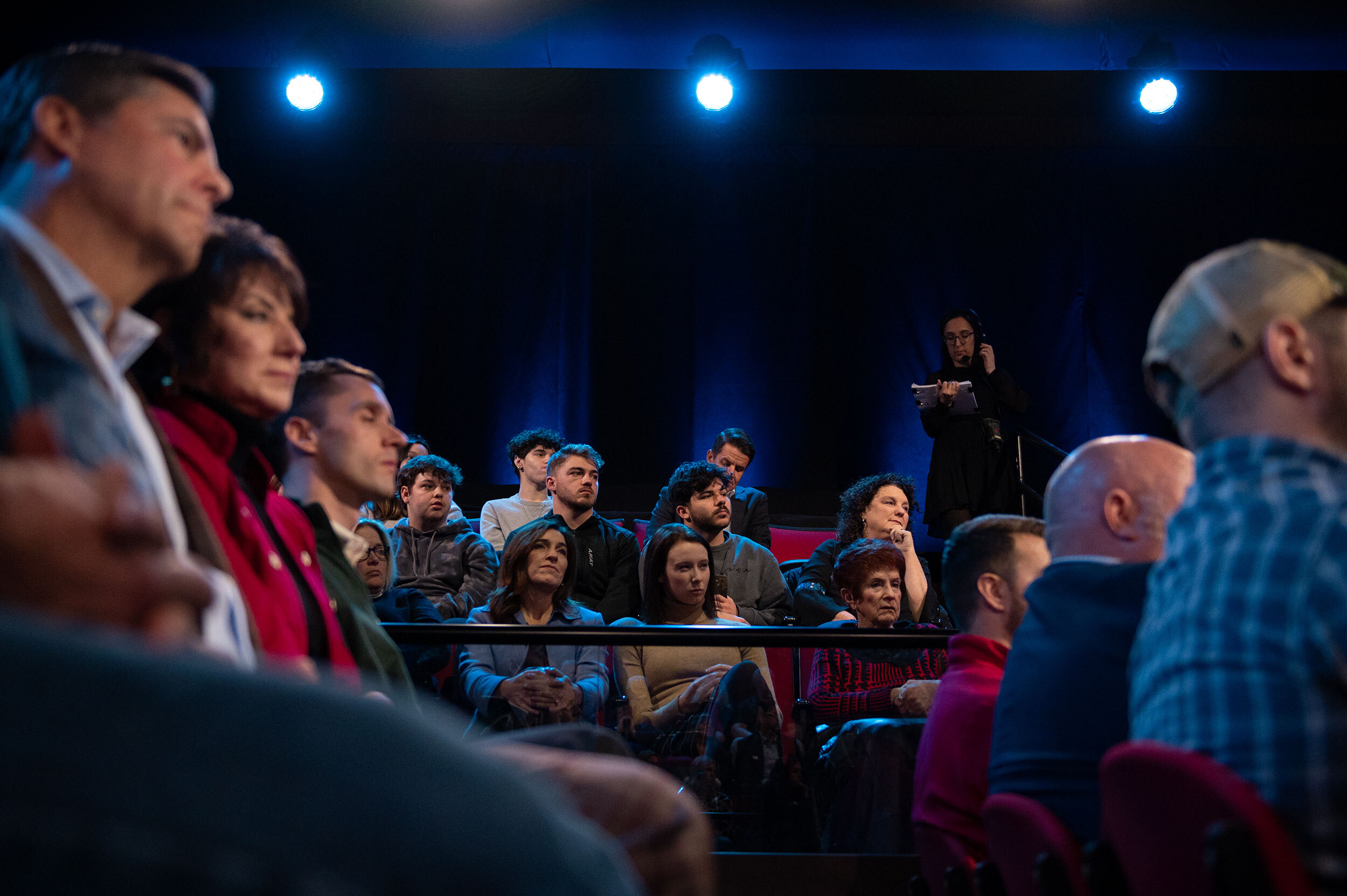 Audience members listen as Florida Gov. Ron DeSantis answers a question during the town hall.