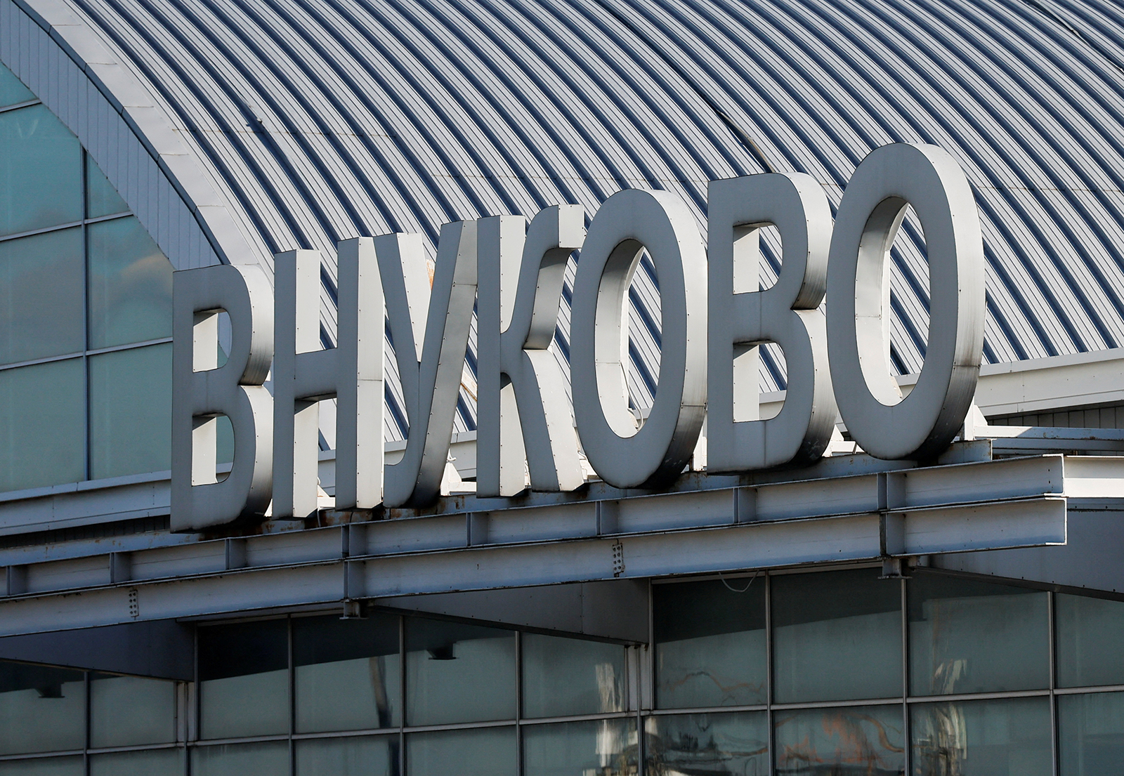 A sign with the name of Vnukovo International Airport is seen on the rooftop of its terminal in Moscow, Russia on August 21.