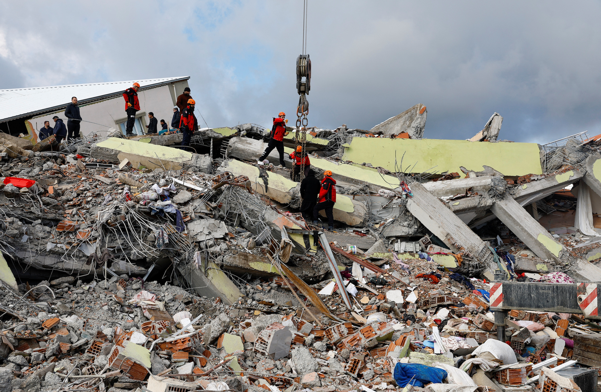 Rescuers search for survivors at the site of a collapsed building in Gaziantep, Turkey, on Tuesday.