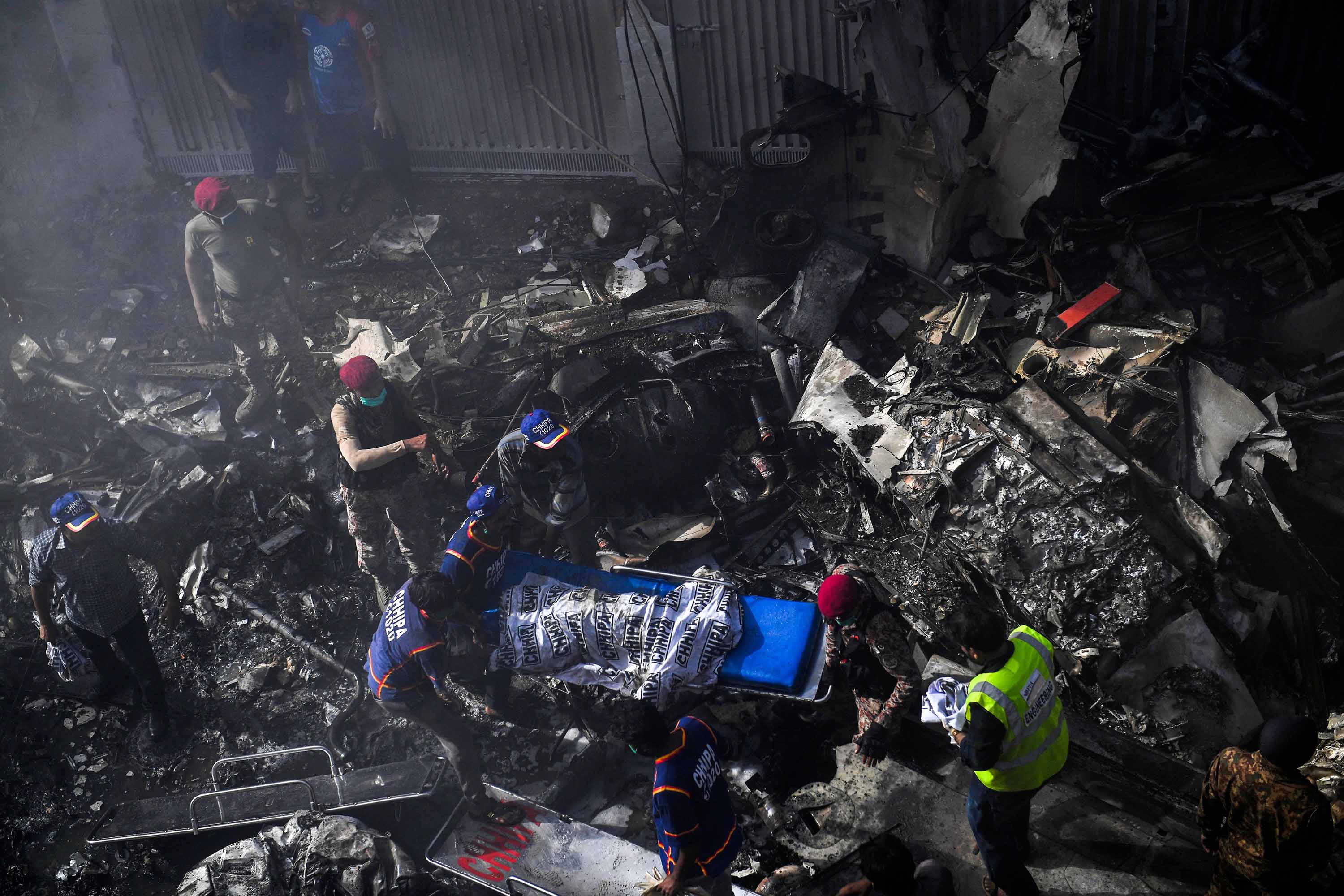 Karachi Crash Pakistani Airliner Crashes With Over 100 On Board 