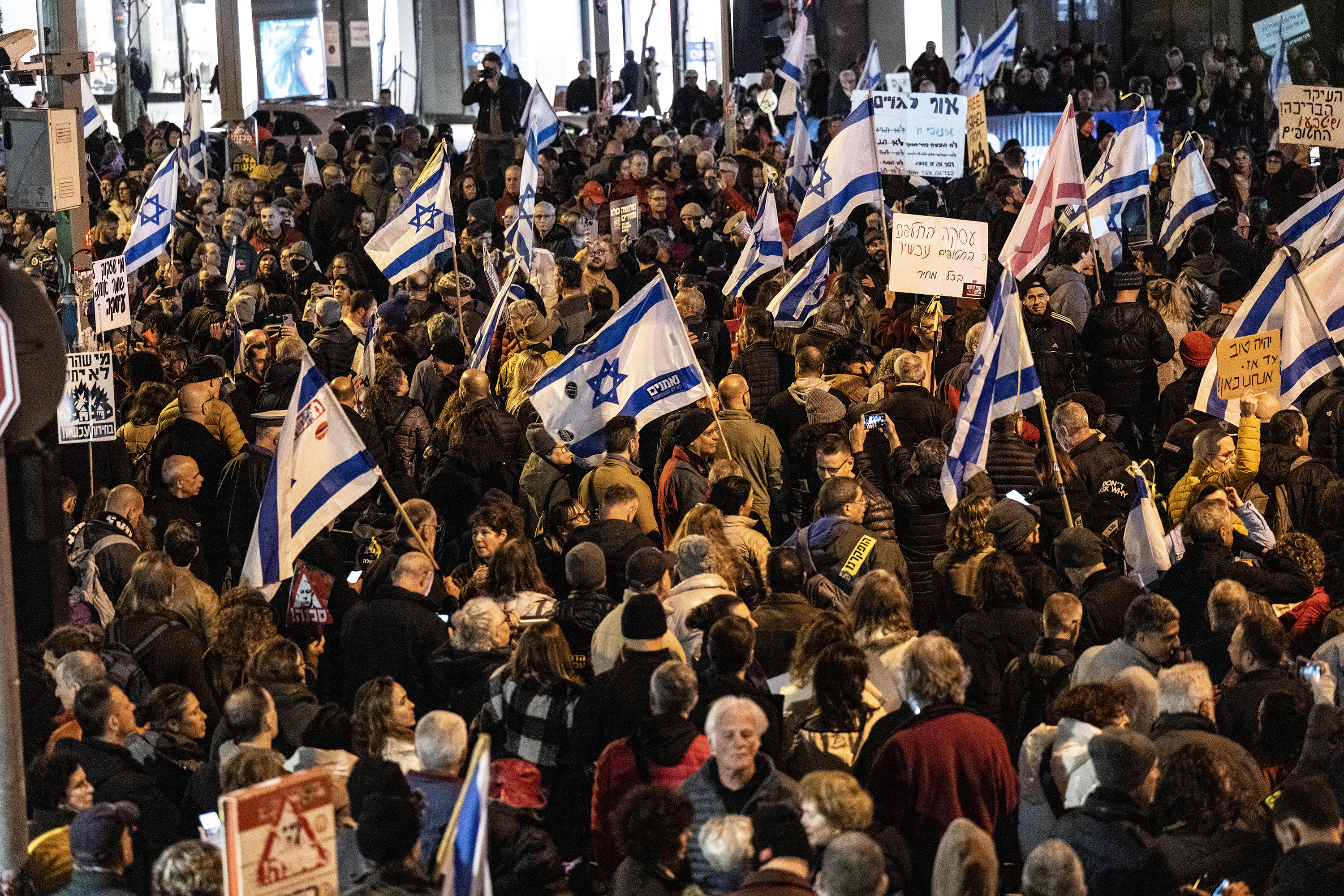 Protesters gather to stage a demonstration demanding the resignation of the government and the holding of early elections in Tel Aviv, Israel on February 3.