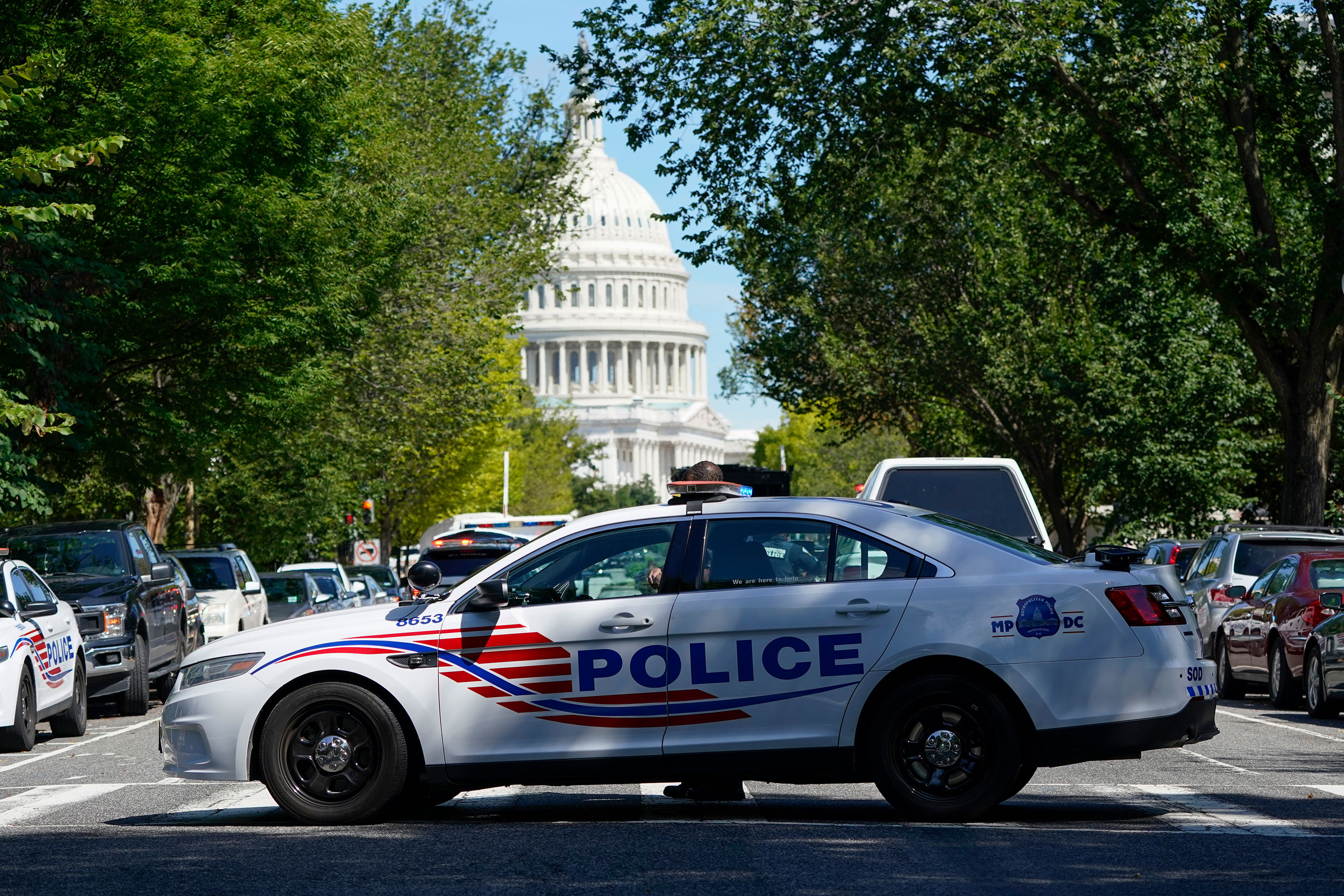 A Metropolitan Police Department cruiser blocks a street near the Capitol and a Library of Congress on August 19.