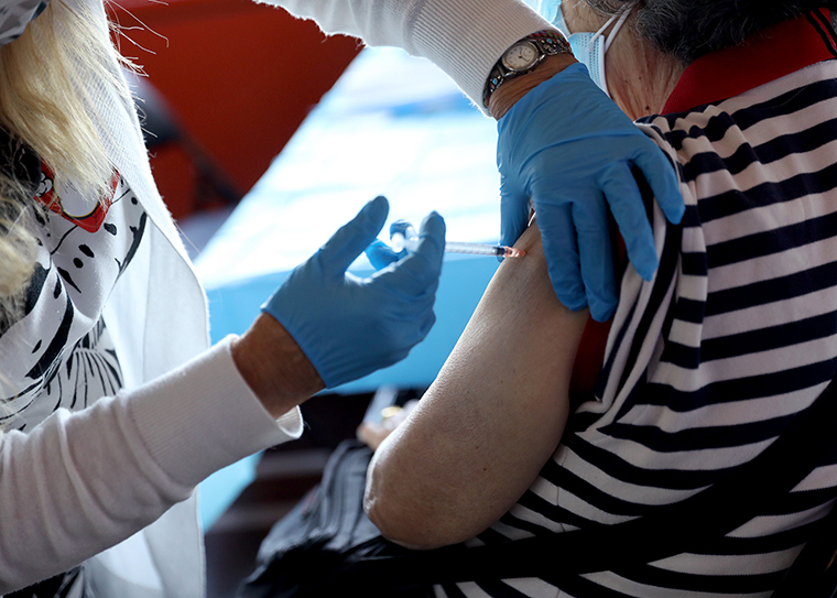 A healthcare worker administers the vaccine as the Empire State Building Offers COVID-19 Vaccines at its Observatory on June 18, 2021 in New York City. 