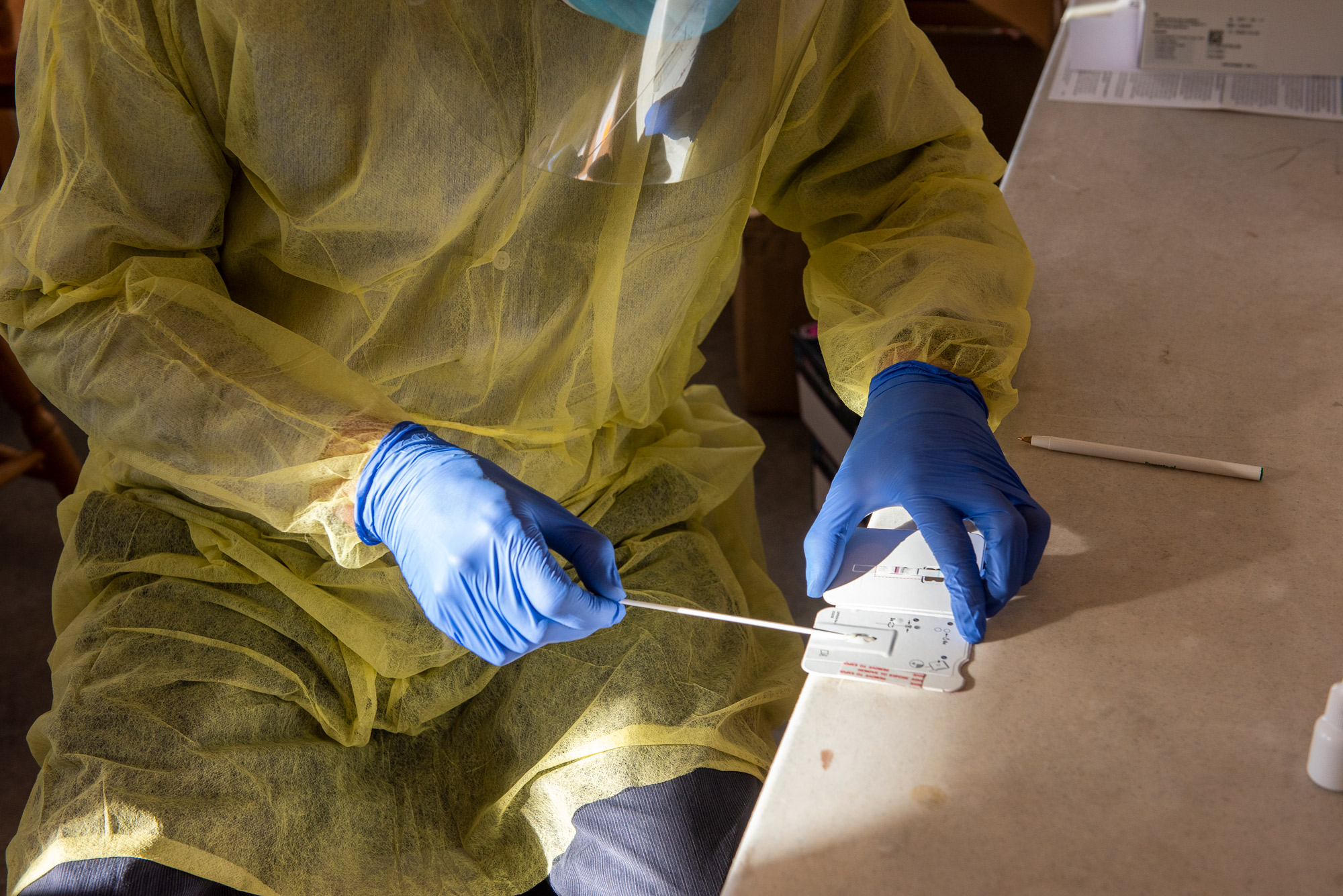 A COVID-19 test is performed using the Abbot BinaxNOW rapid test at the Fairgrounds on December 7, 2020 in Livingston, Montana. 