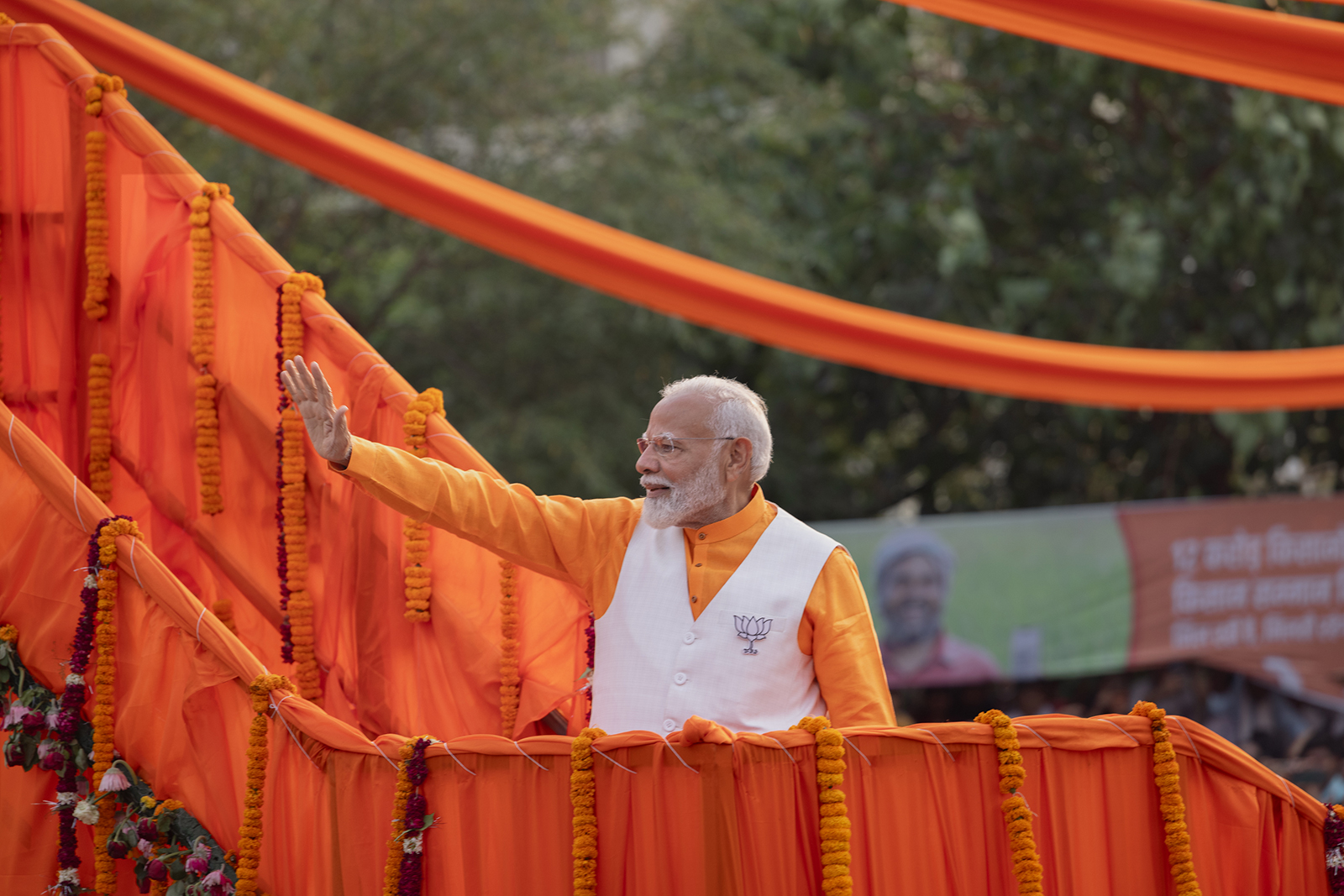 India's Prime Minister, Narendra Modi, greets his supporters during a roadshow on May 13, in Varanasi.