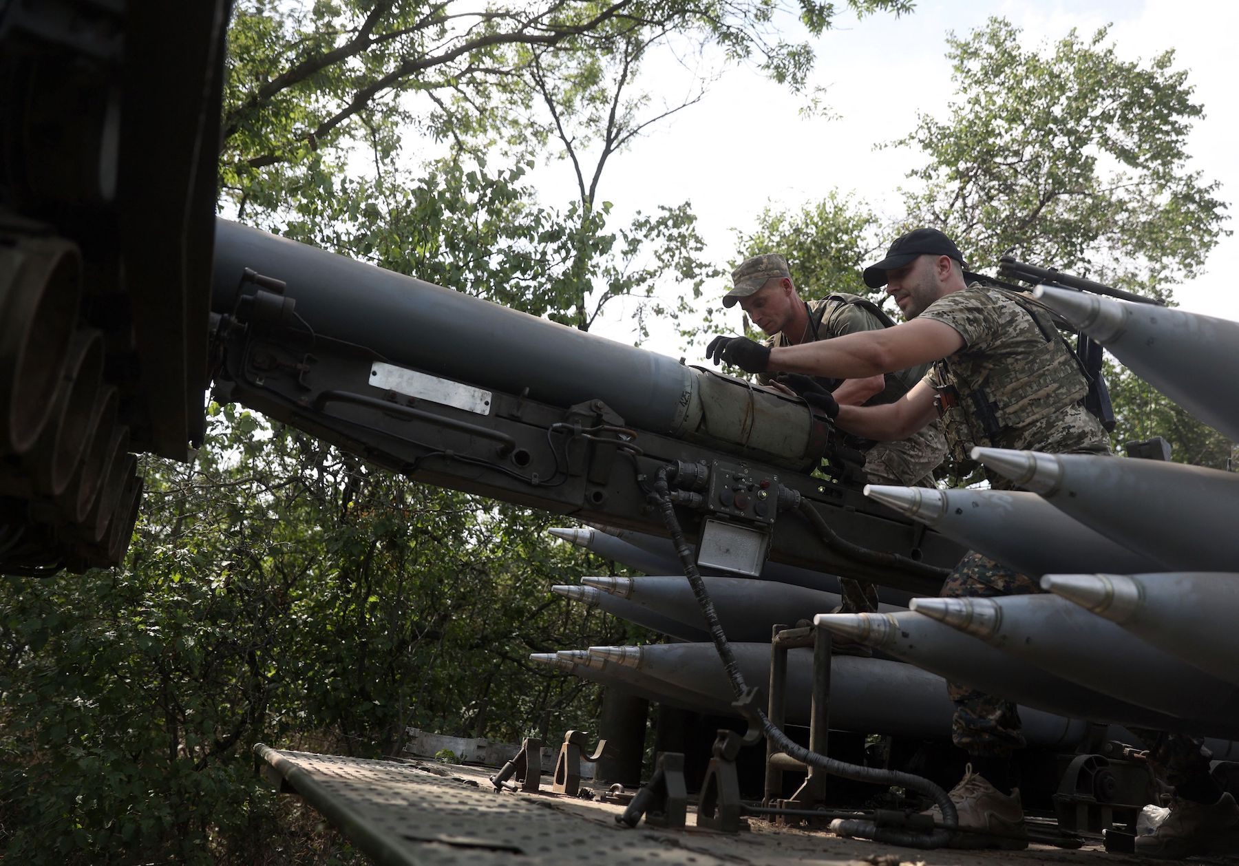 Ukrainian gunners prepare to fire with a self-propelled multiple rocket launcher at a position near a frontline in Donetsk region on August 27.