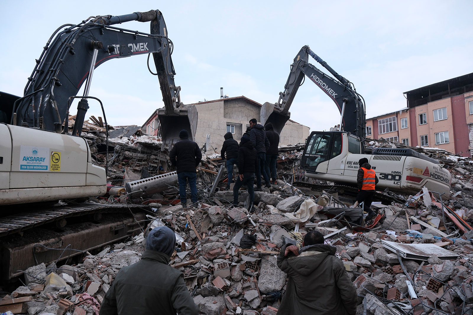 Civilians and rescue volunteers search through debris to find victims on February 8 in Elbistan, Turkey. 