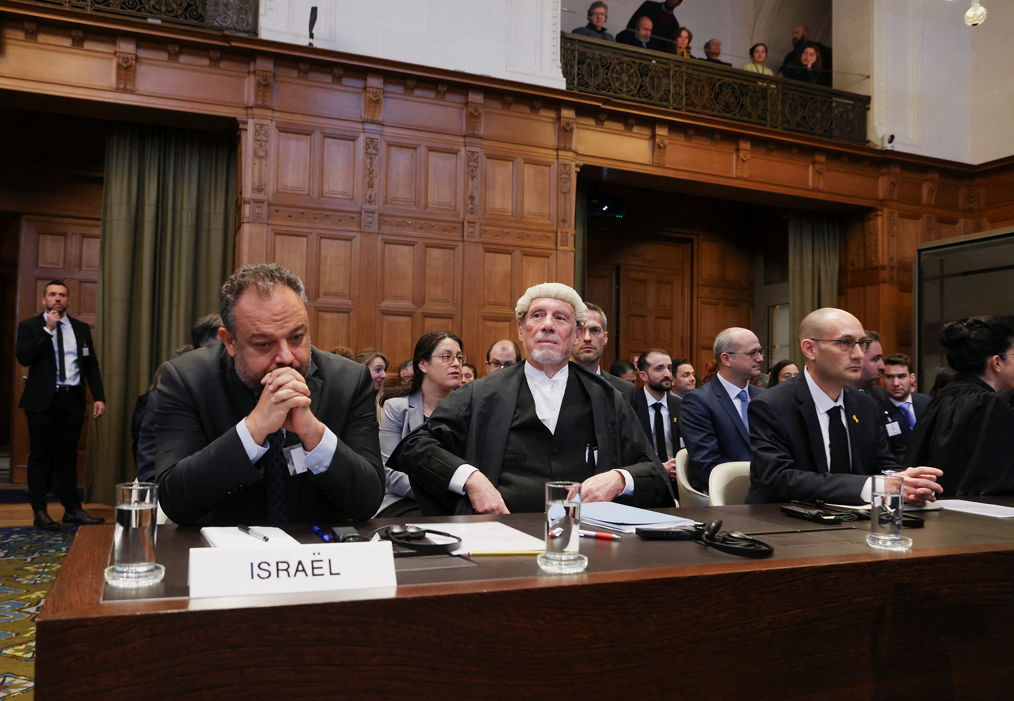 British jurist Malcom Shaw, center, legal adviser to Israel's Foreign Ministry Tal Becker, left, and Israel's deputy attorney-general for international law Gilad Noam look on as judges at the International Court of Justice (ICJ) hear a request for emergency measures by South Africa in The Hague, Netherlands, on January 11.