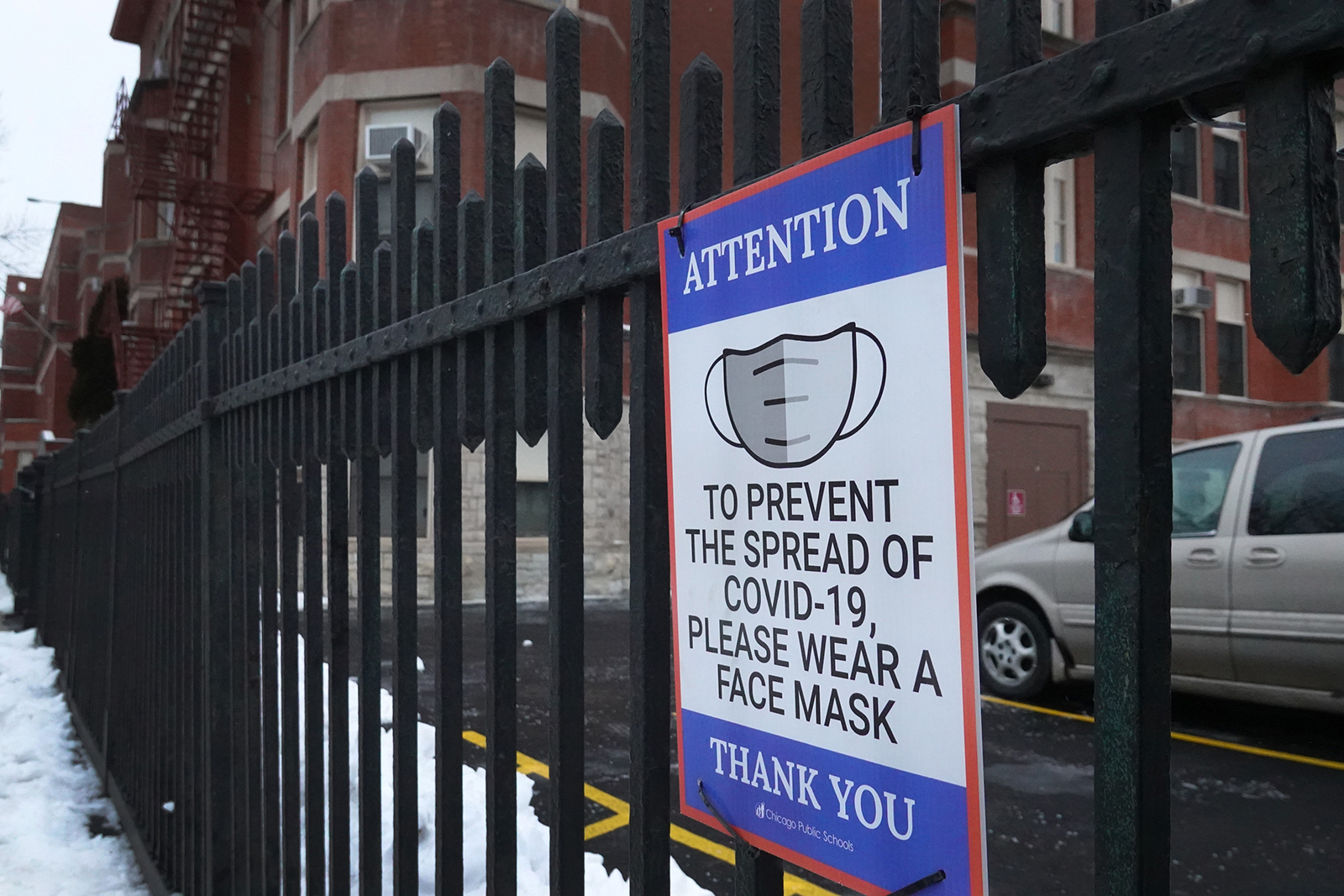 A sign is seen on the fence outside of Lowell elementary school on January 5 in Chicago, Illinois. Classes at all of Chicago public schools have been canceled today by the school district after the teacher's union voted to return to virtual learning, citing unsafe conditions in the schools as the Omicron variant continues to spread. 