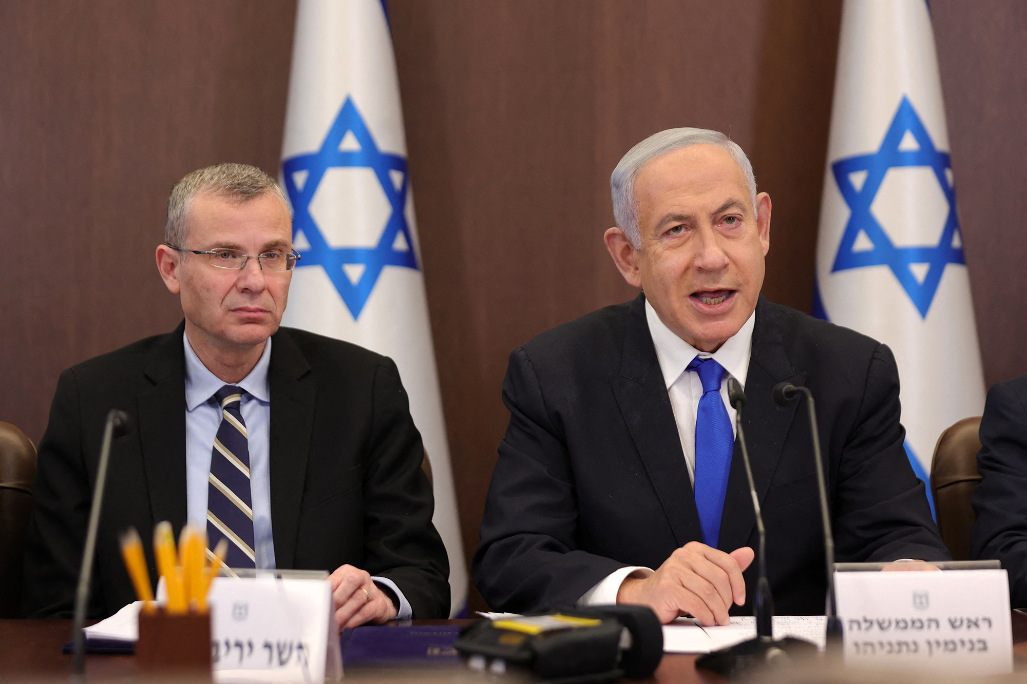 Israeli Prime Minister Benjamin Netanyahu, right, and Justice Minister Yariv Levin attend a cabinet meeting in Jerusalem, in February 2023. 