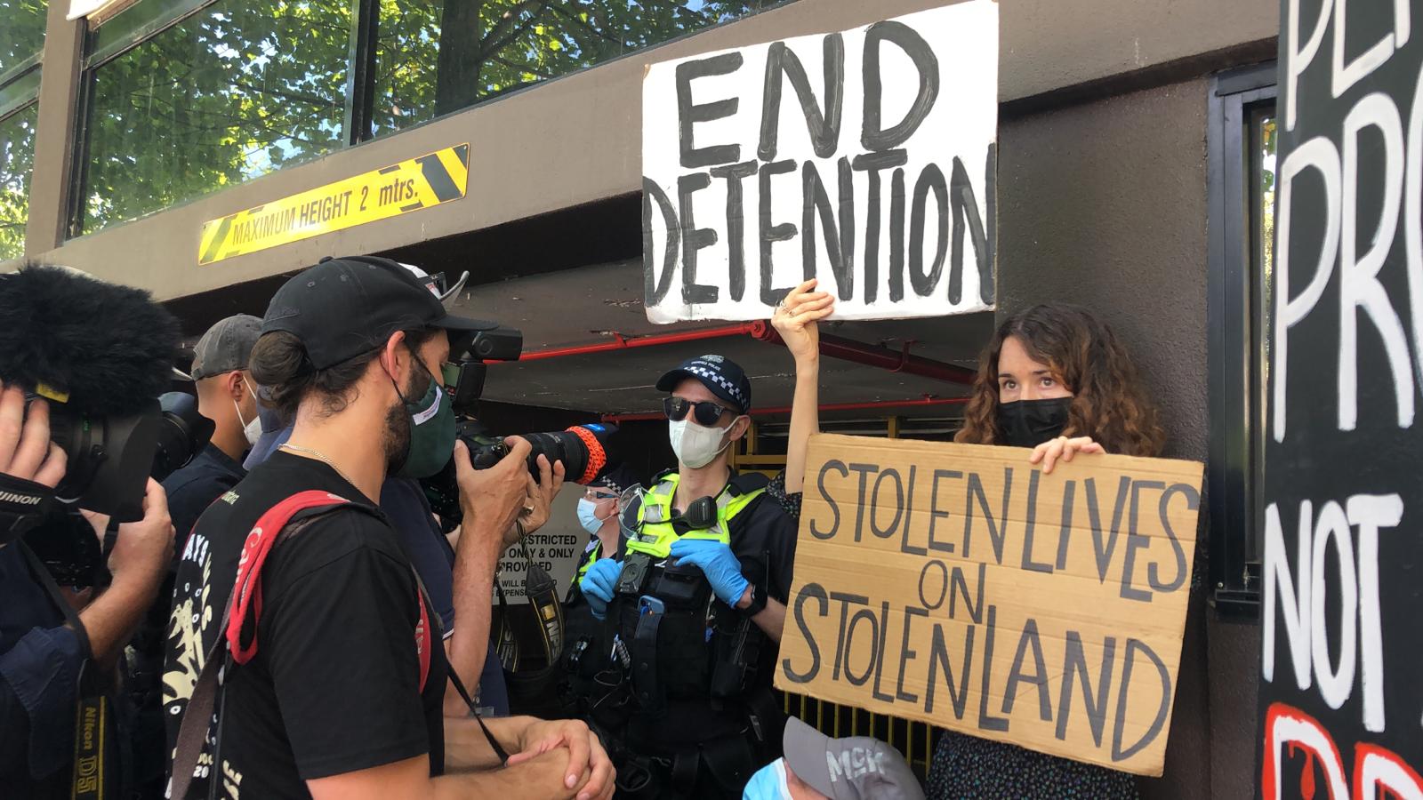A crowd of media alongside police and protesters at the Park Hotel in Melbourne, Australia on January 10.