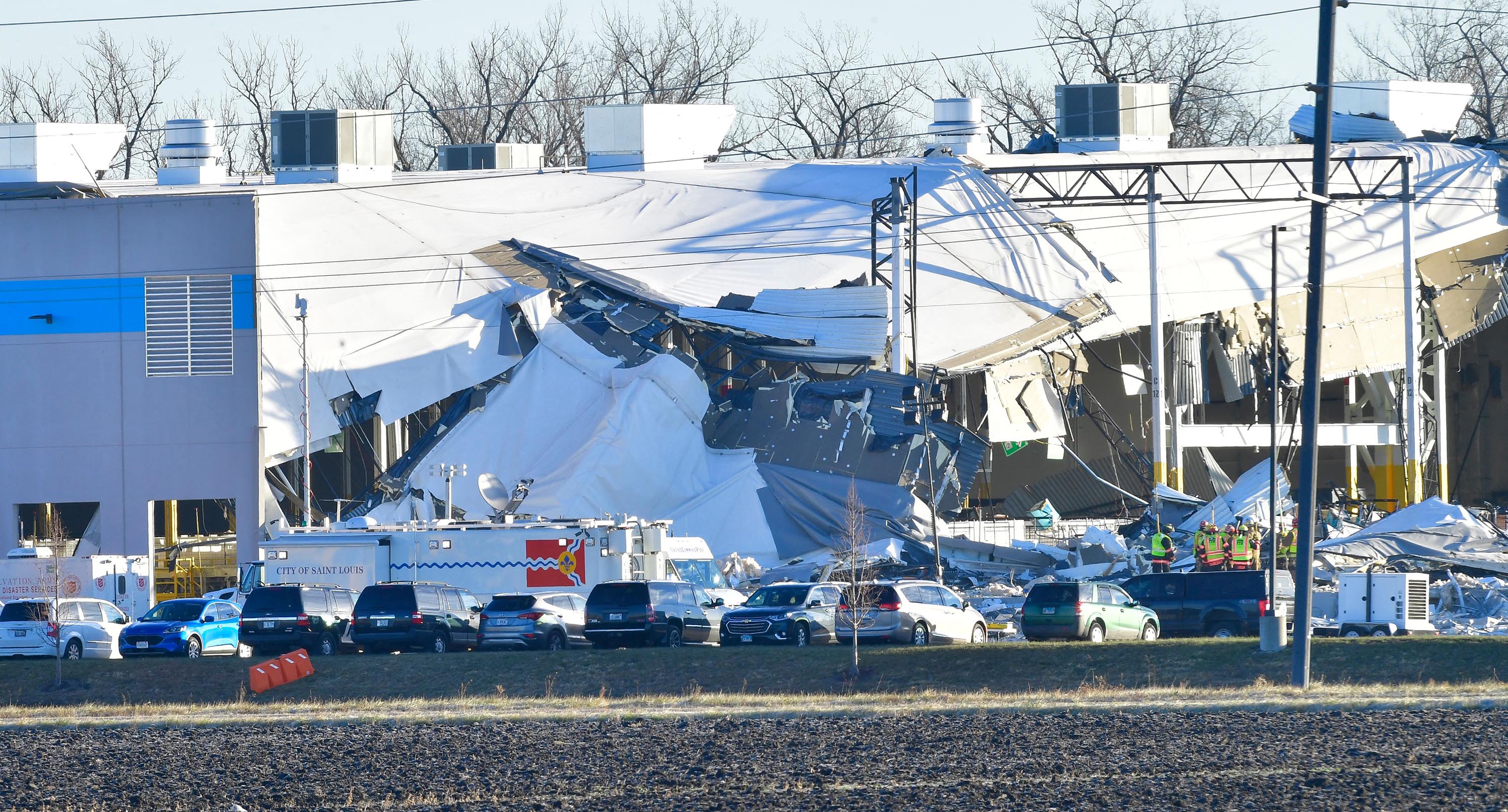 Recovery operations continue on Sunday, December 12, after the partial collapse of an Amazon Fulfillment Center in Edwardsville, Illinois.