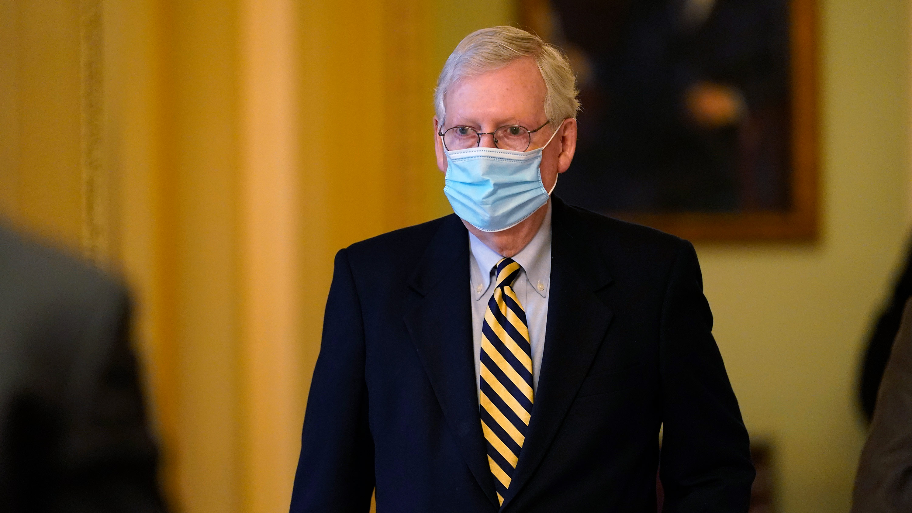 Senate Minority Leader Mitch McConnell walks through the Capitol building on Monday, January 25, in Washington, DC. 