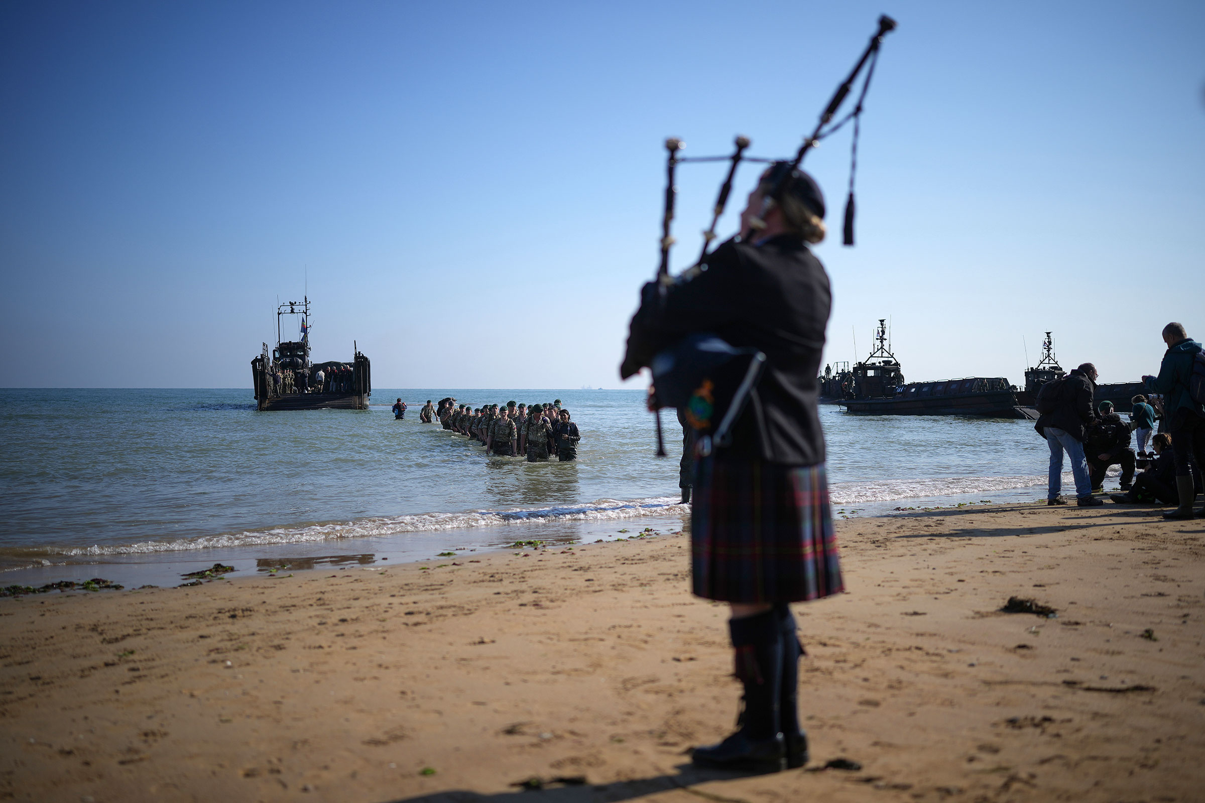 Royal Marines of 47 Commando land at Gold Beach to mark the 80th anniversary of the D-Day landing on June 6, in Asnelles, France. 