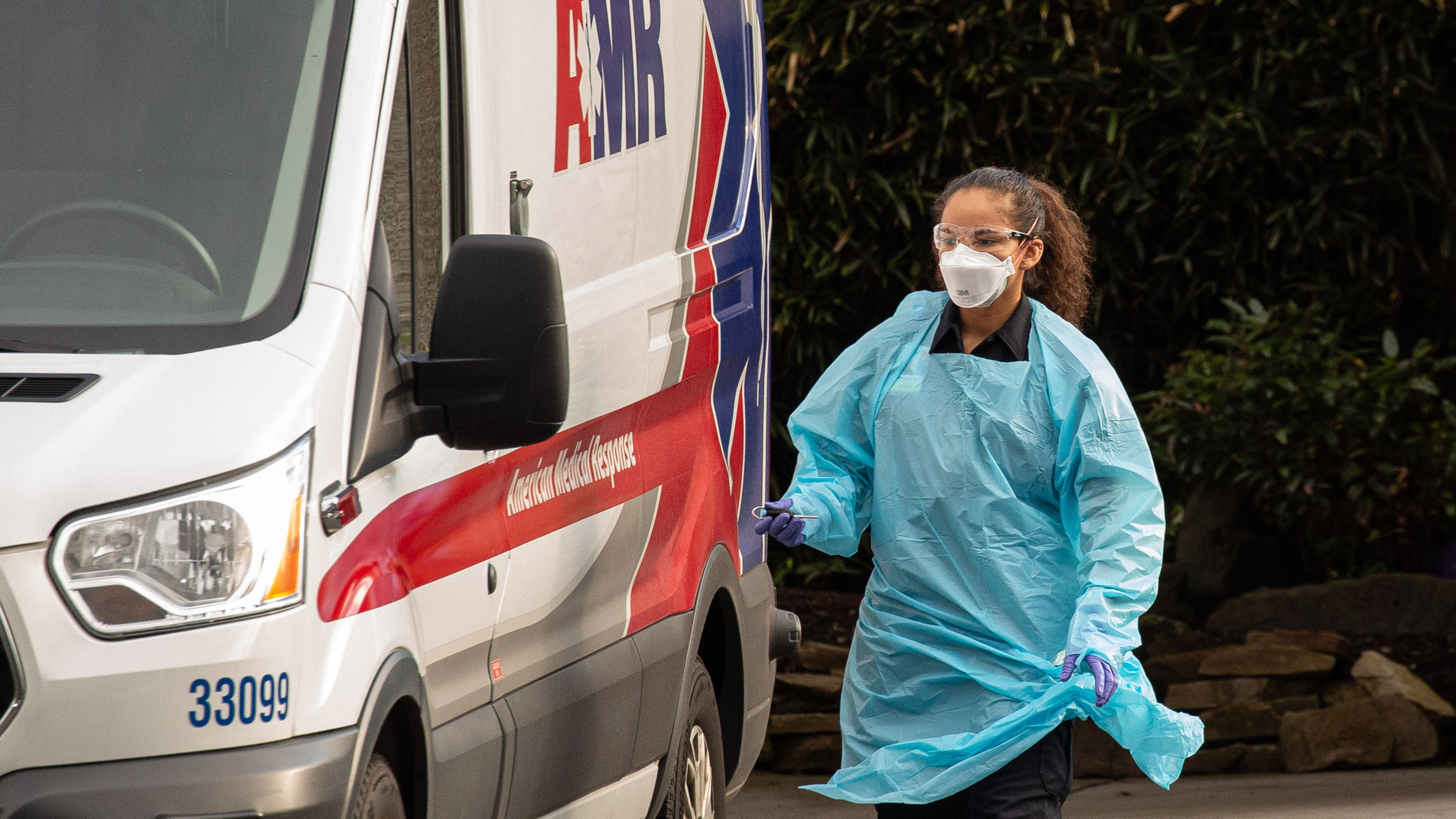 An ambulance driver prepares to transport a patient from the Life Care Center of Kirkland in Washington on February 29, where multiple staff and residents have reportedly exhibited coronavirus-like symptoms.