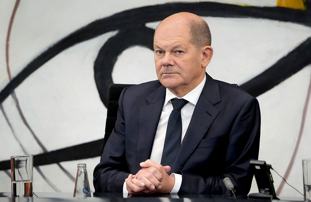German Chancellor Olaf Scholz attends a press conference after a meeting of the representatives of international finance- and economy organizations at the chancellery in Berlin, Germany, Tuesday, November 29. 