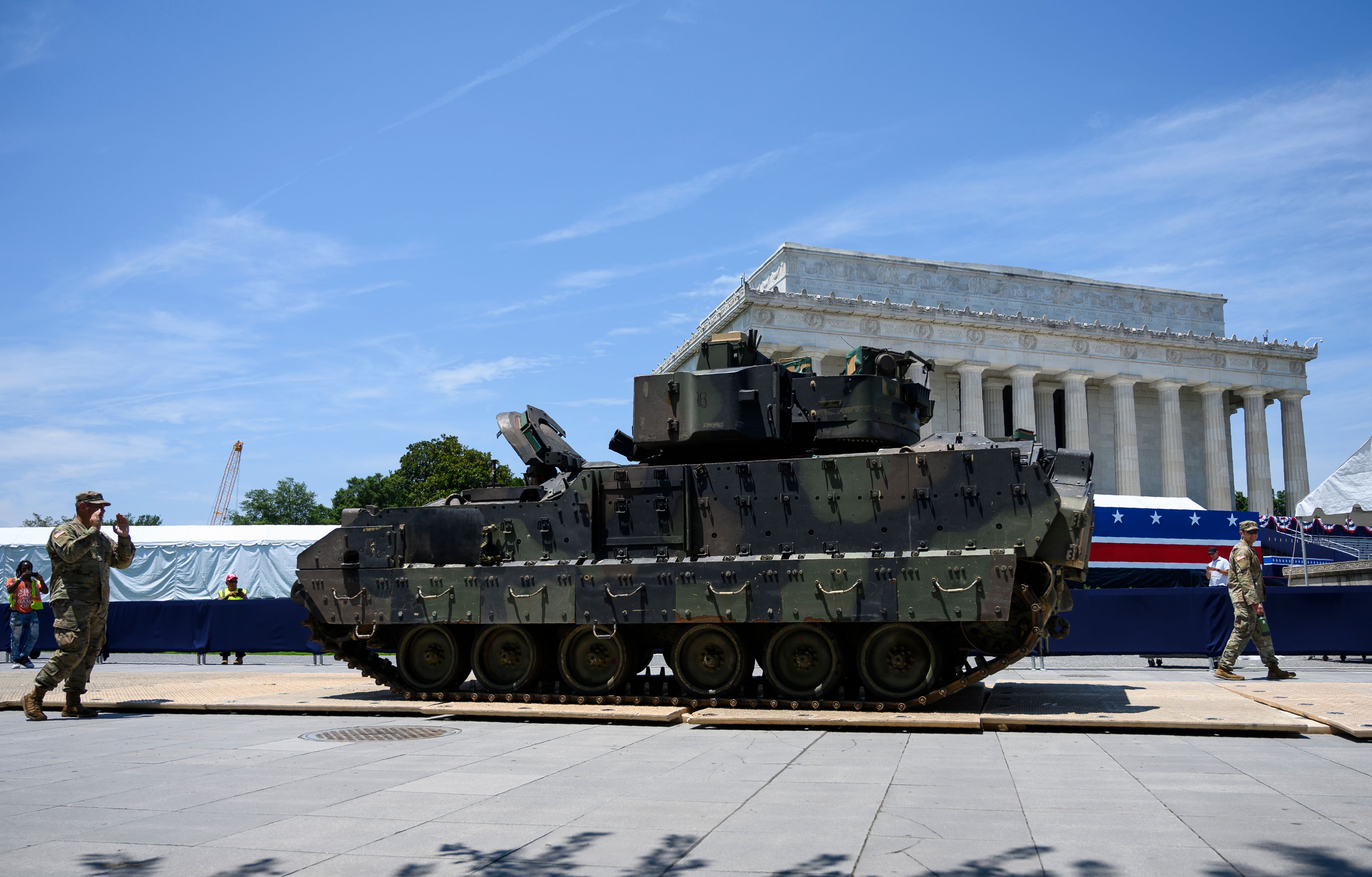 Members of the US military guide a Bradley Fighting Vehicle on July 3, 2019 as preparations are made for the "Salute to America" event at the Lincoln Memorial on the National Mall in Washington, DC.