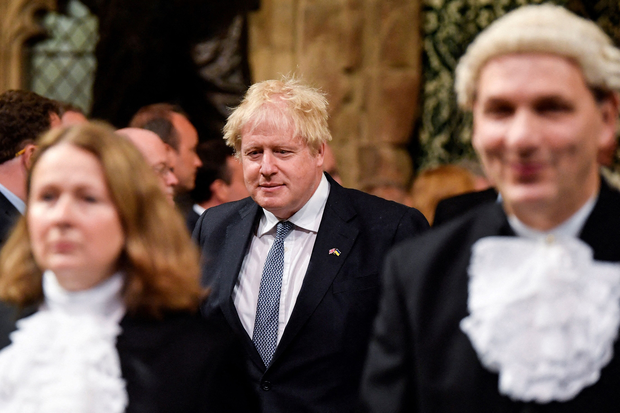 Britain's Prime Minister Boris Johnson processes through the House of Commons Members' Lobby during the State Opening of Parliament, at the Houses of Parliament, in London, England, on May 10.