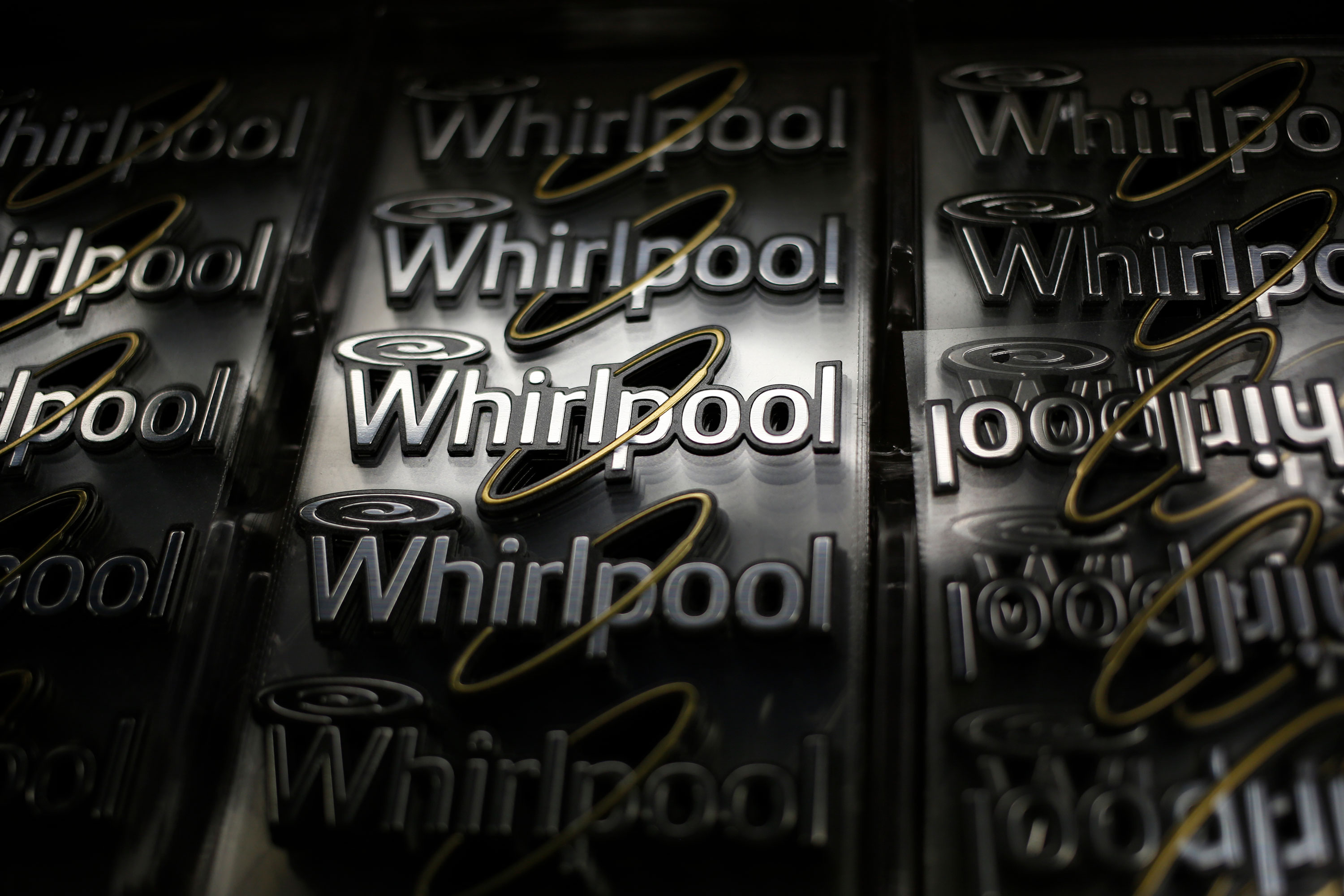 Whirlpool logos are seen before being attached to washing machines at the company's manufacturing facility in Clyde, Ohio, in 2015.