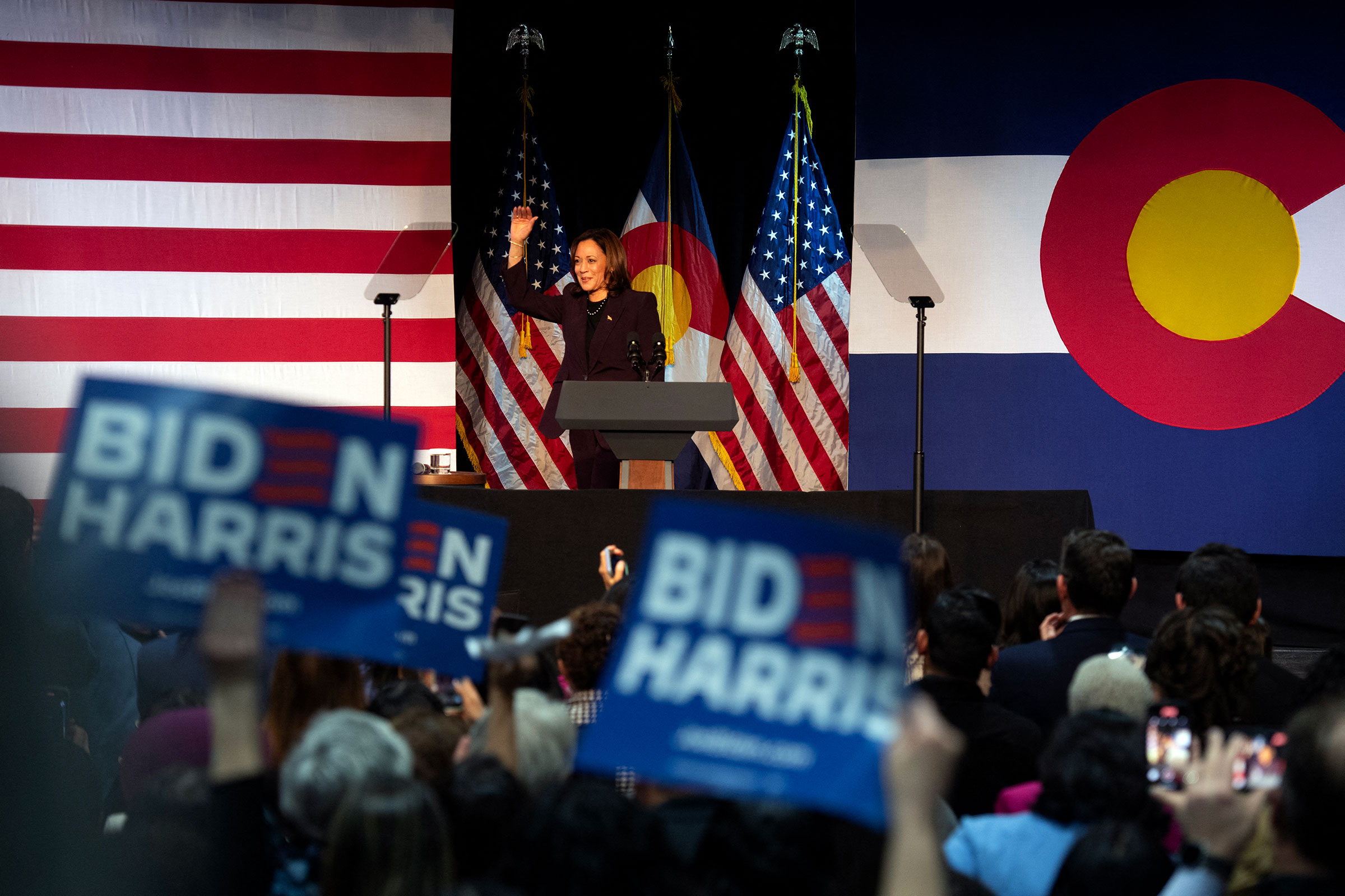 Vice President Kamala Harris waves to supporters at the start of a campaign rally at Reelworks in Denver, Colorado, on Tuesday.