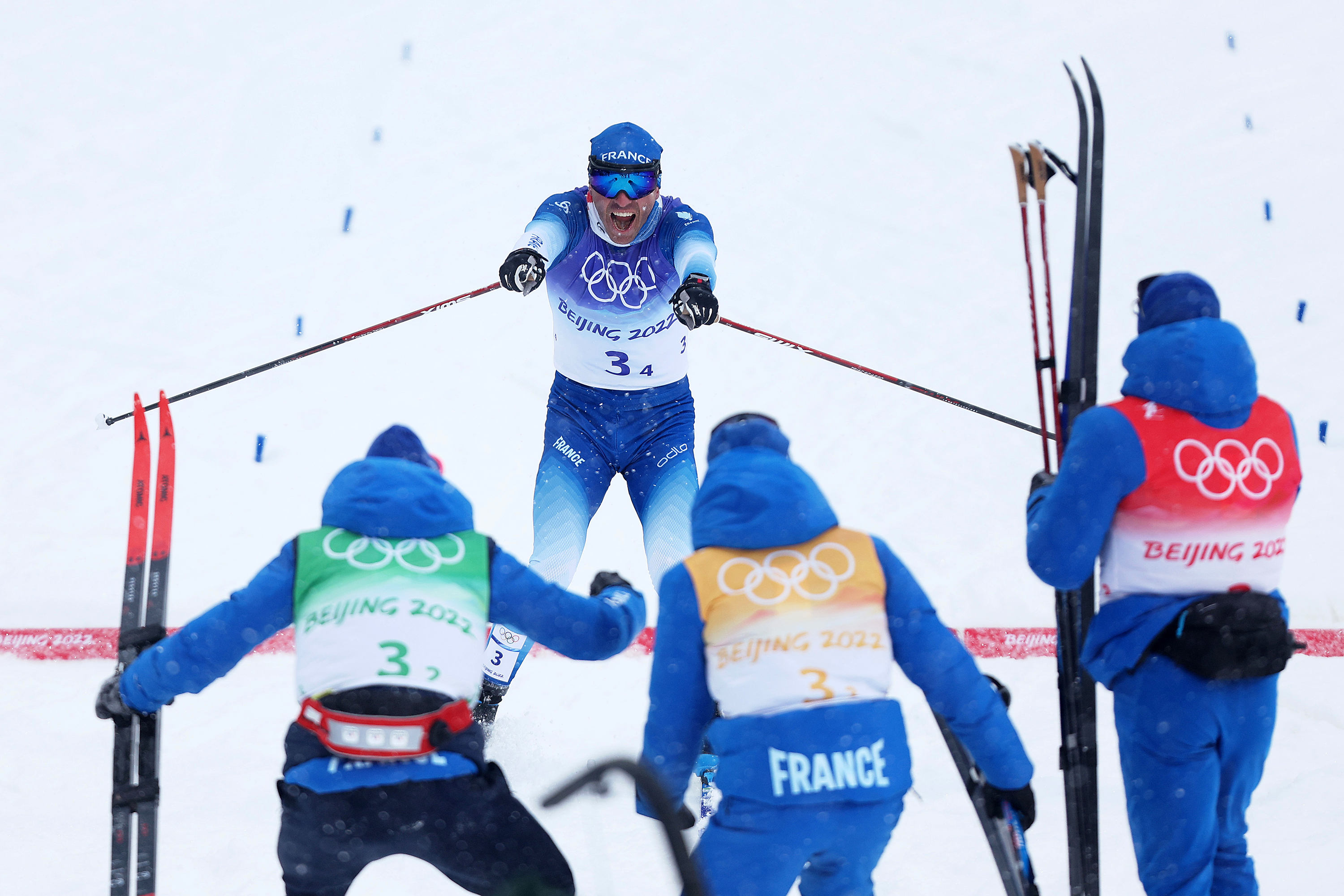 France’s Maurice Manificat celebrates with his teammates after winning the bronze medal in the men’s cross-country skiing 4x10km relay on Sunday.