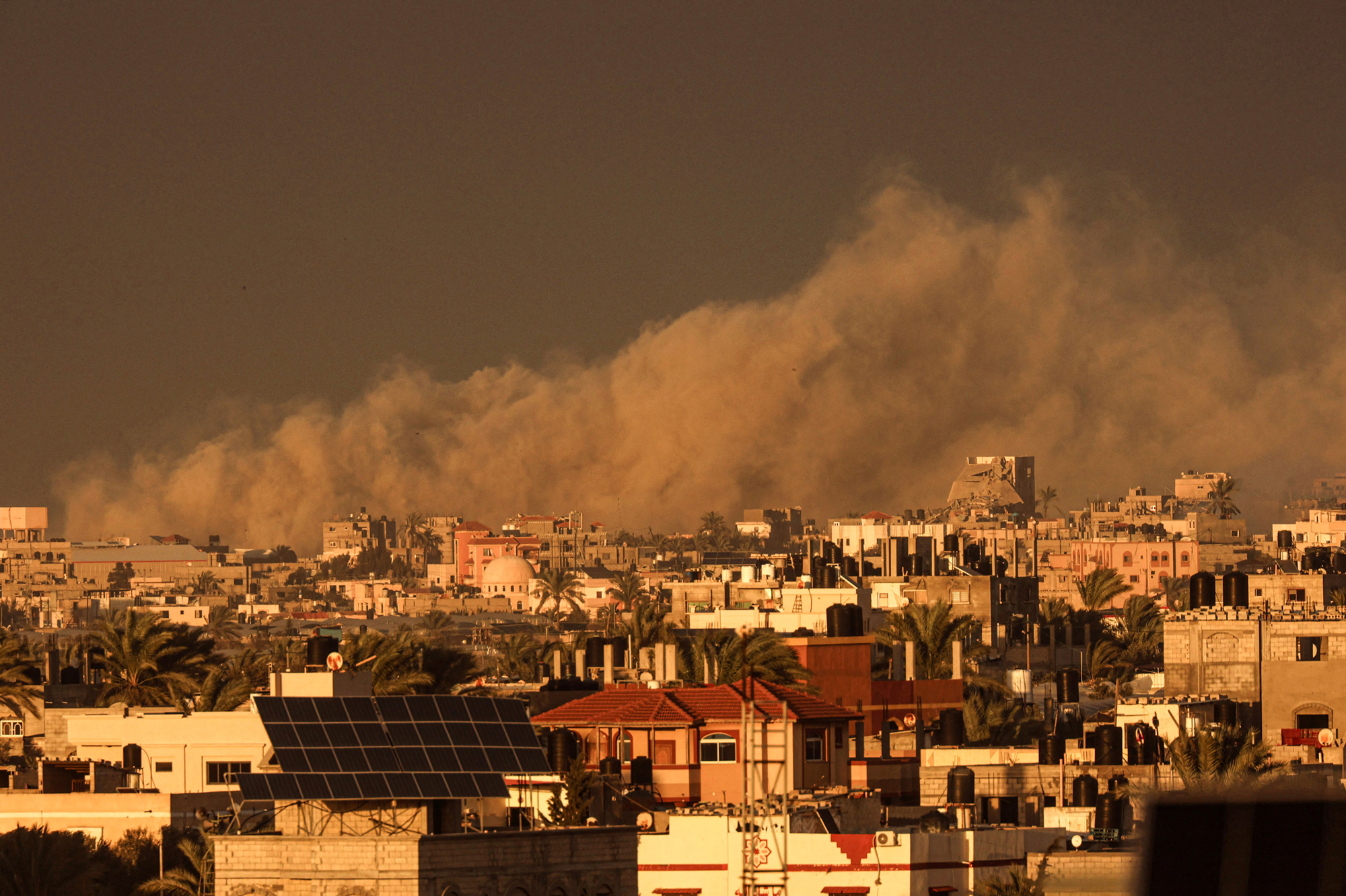 A picture taken from Rafah shows smoke billowing over Khan Younis, southern Gaza, during Israeli bombardment on January 11.