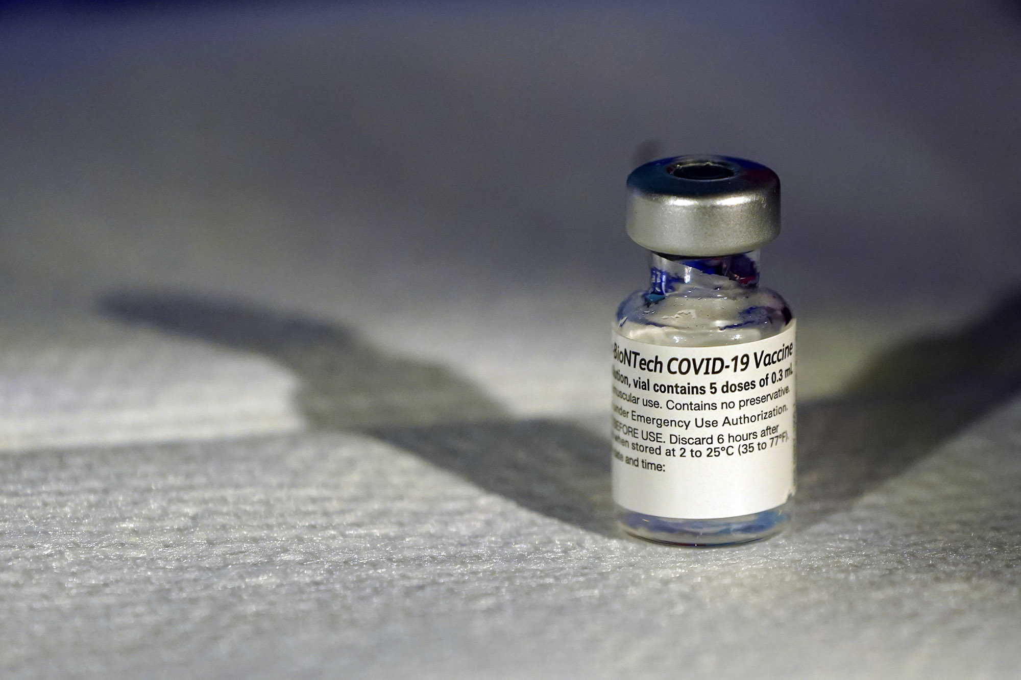 A vial of Pfizer's Covid-19 vaccine that received emergency use authorization is seen at George Washington University Hospital on December 14, in Washington, DC. 