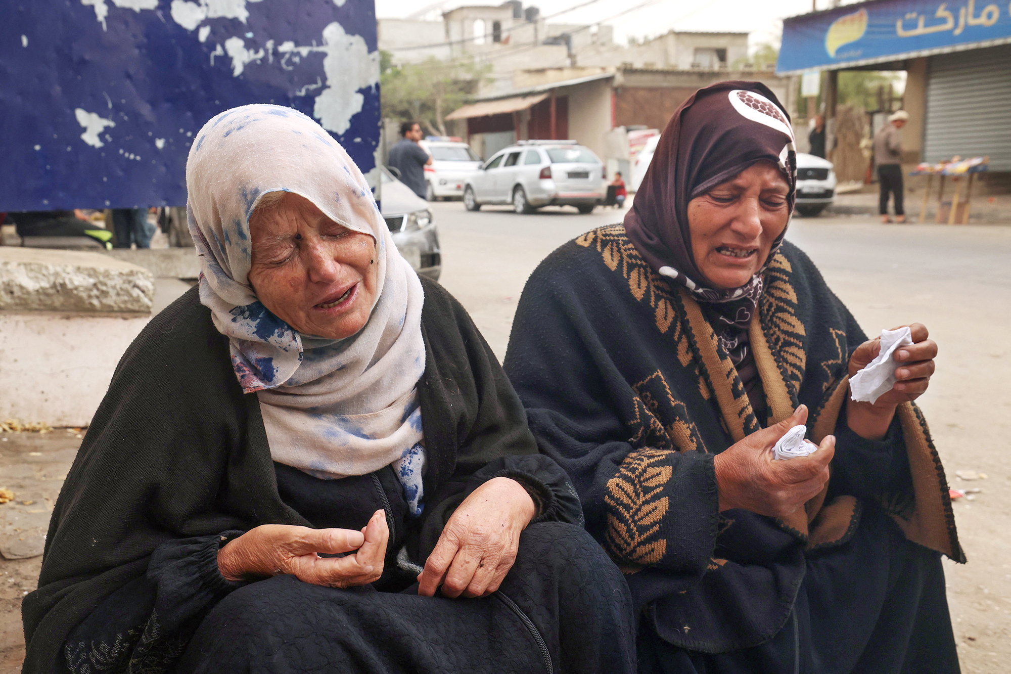 Palestinian women mourn the death of loved ones outside Al-Najjar hospital following overnight Israeli bombardment in Rafah, Gaza, on April 18.