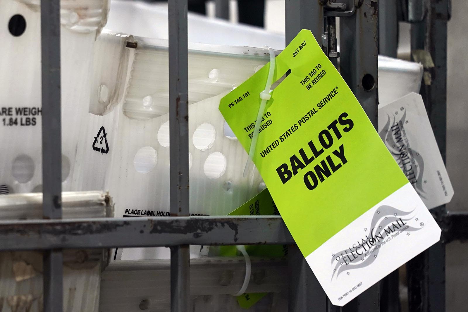 Vote-by-mail ballots sit ready for transport to a local U.S. Postal Service office at the Broward Supervisor of Elections Office, on Thursday, September 24, in Lauderhill, Florida.