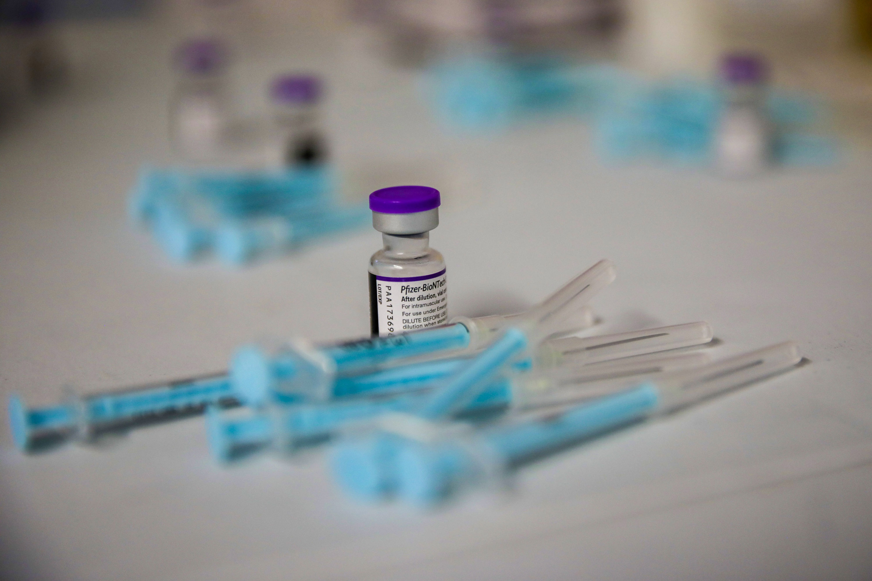 A vial and prepared doses of the Pfizer-BioNTech Covid-19 vaccine at the Grassy Park civic center in Cape Town, South Africa, on Nov. 30, 2021. 
