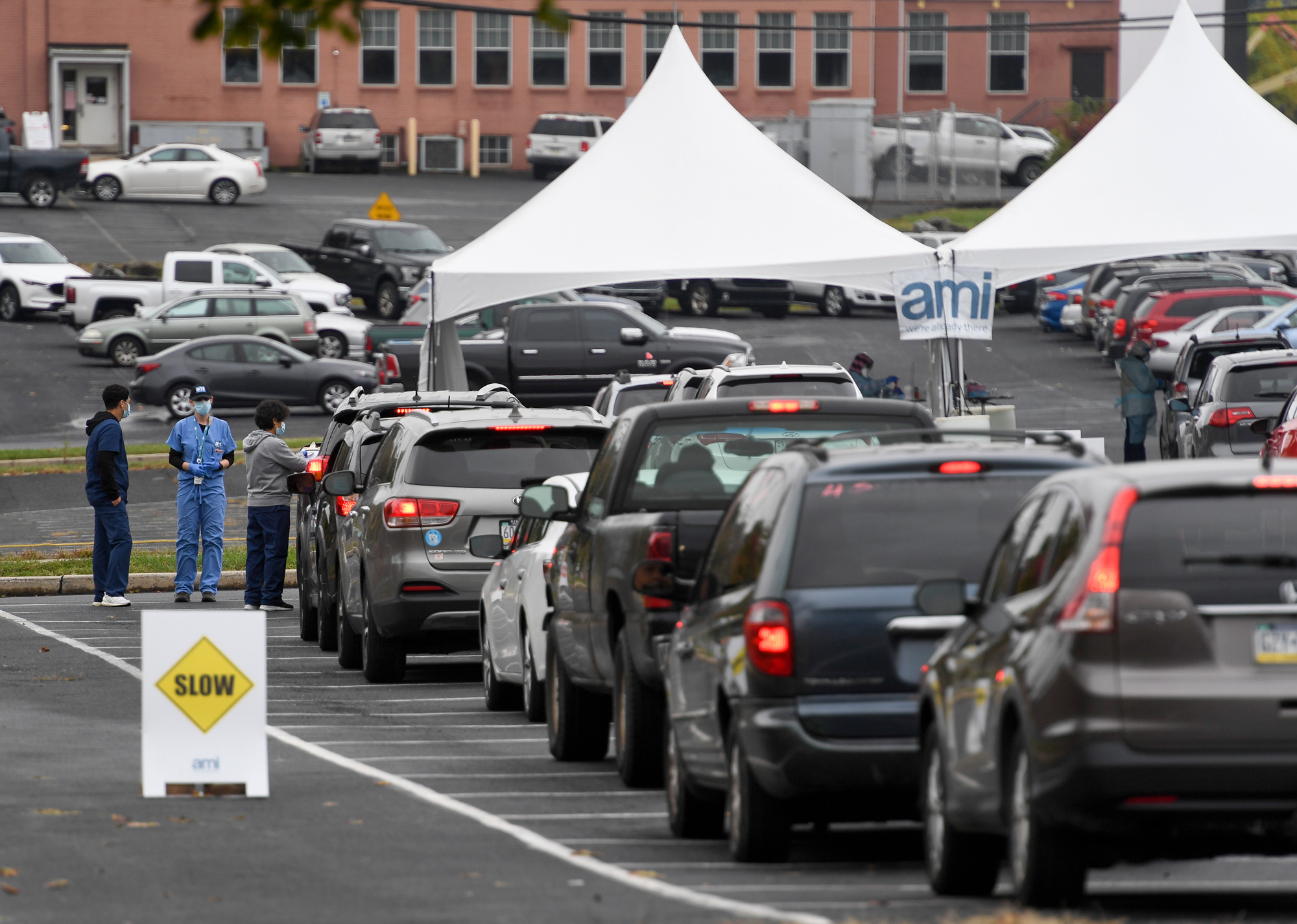 People in cars wait in line for COVID-19 testing in Reading, Pennsylvania, outside FirstEnergy Stadium on October 13.