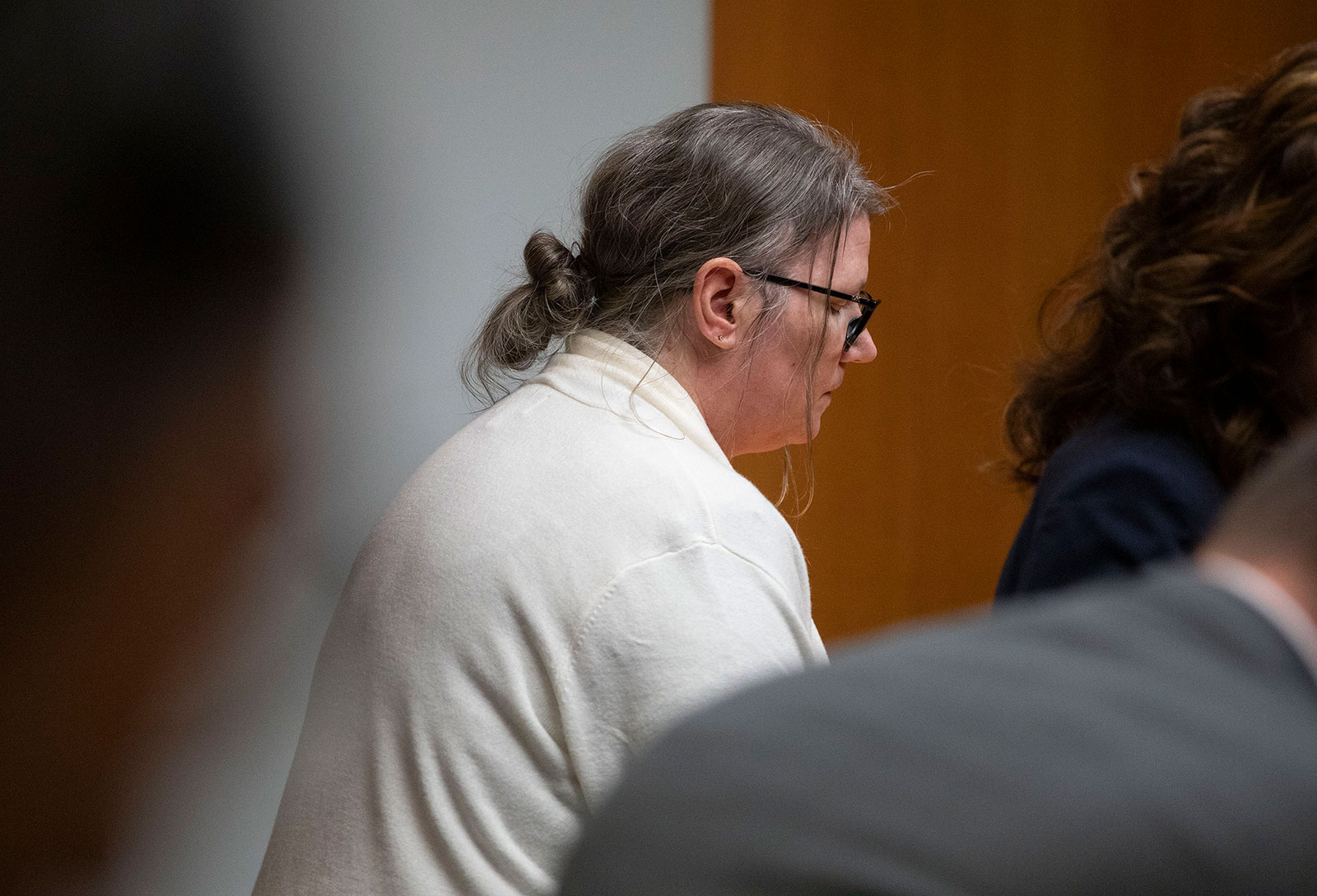 Jennifer Crumbley stands to exit the courtroom in Oakland County Circuit Court after the jury found her guilty on four counts of involuntary manslaughter on Tuesday in Pontiac, Michigan. 