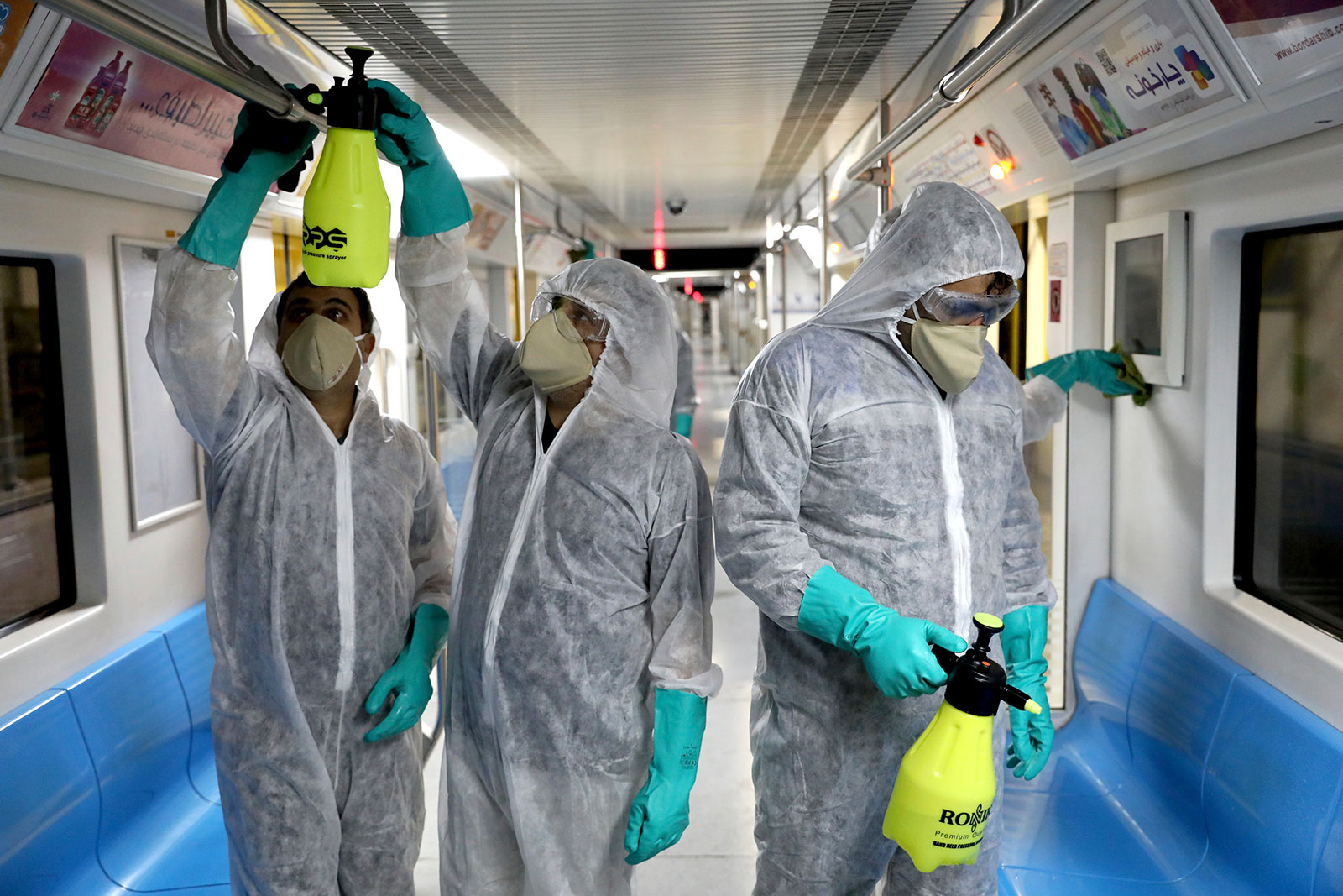 Workers disinfect subway trains against coronavirus in Tehran on February 26.