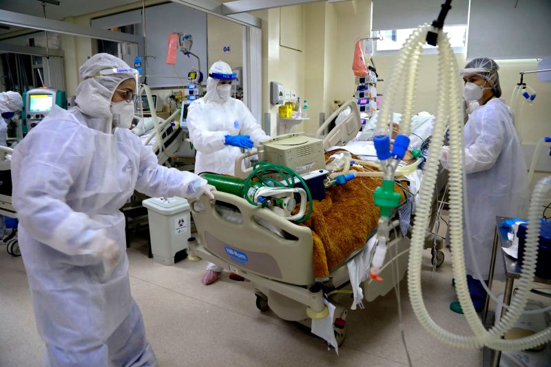 Medical personnel treat a coronavirus patient in the Intensive Care Unit of the Santa Casa de Misericordia Hospital on August 13 in Porto Alegre, Brazil. 