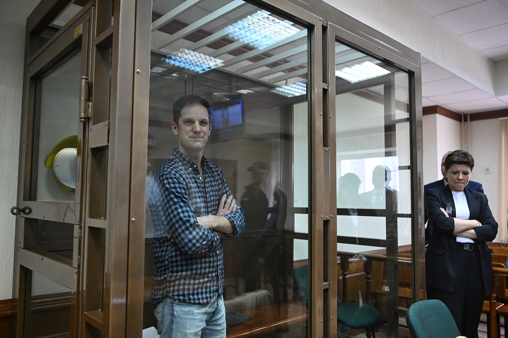 US journalist Evan Gershkovich stands inside a defendants' cage before a hearing to consider an appeal on his arrest at the Moscow City Court in Moscow, Russia, on April 18.