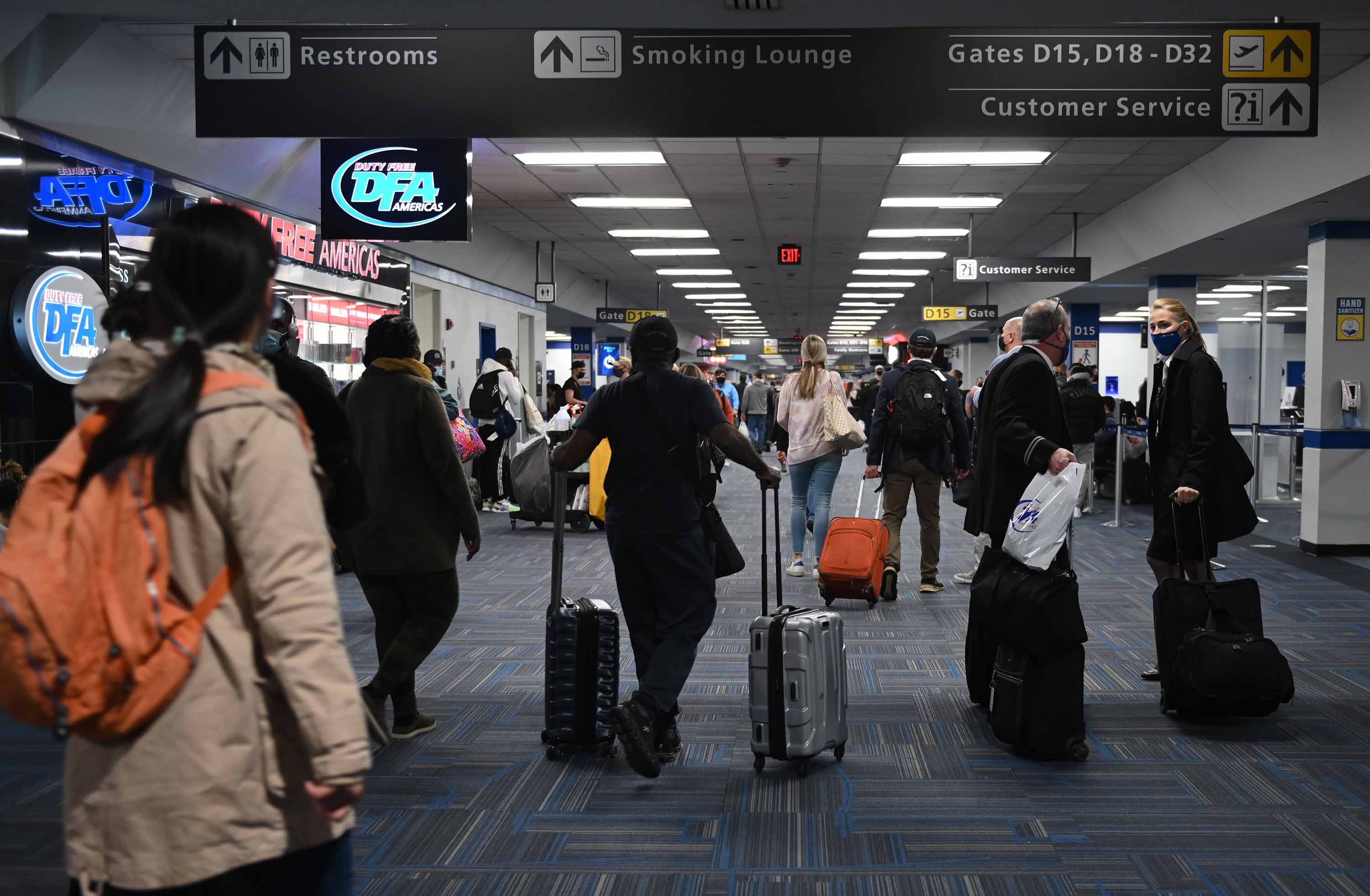 Passengers walk through a terminal at Dulles International airport in Virginia on Sunday, December 27.