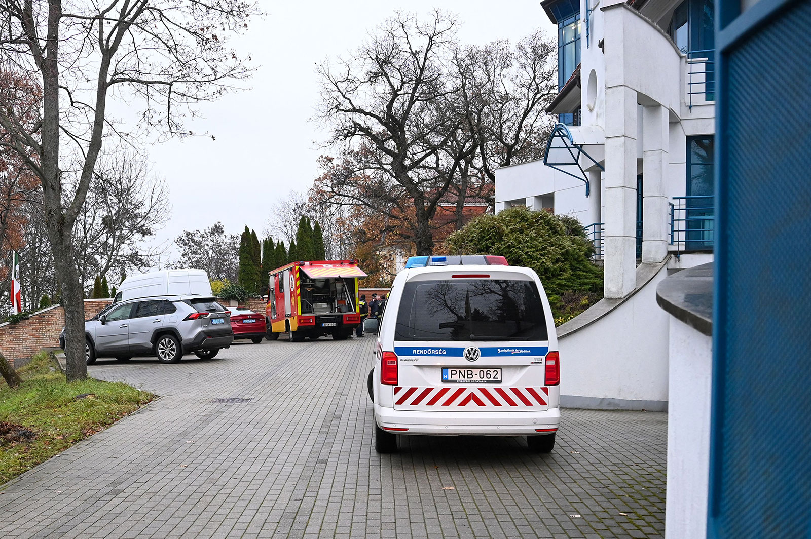 A local fire engine and police car are seen with some diplomatic cars in front of Ukraine's embassy in Budapest on December 2.
