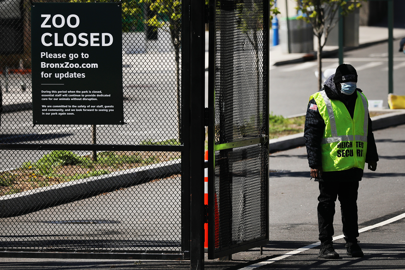 A guard stands at the entrance to the Bronx Zoo on April 6, in New York City.