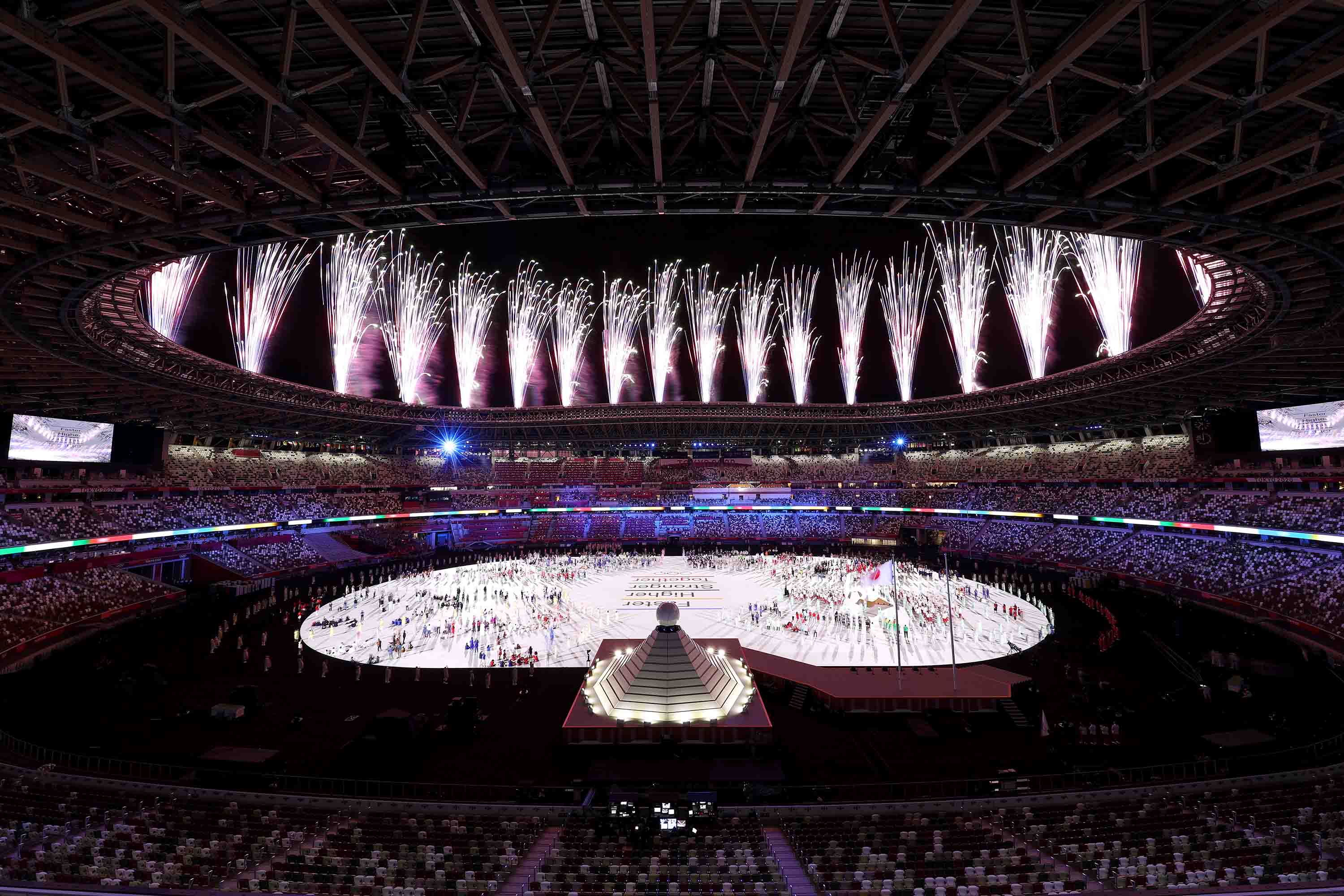 A general view shows inside the Olympic Stadium as fireworks are set off.