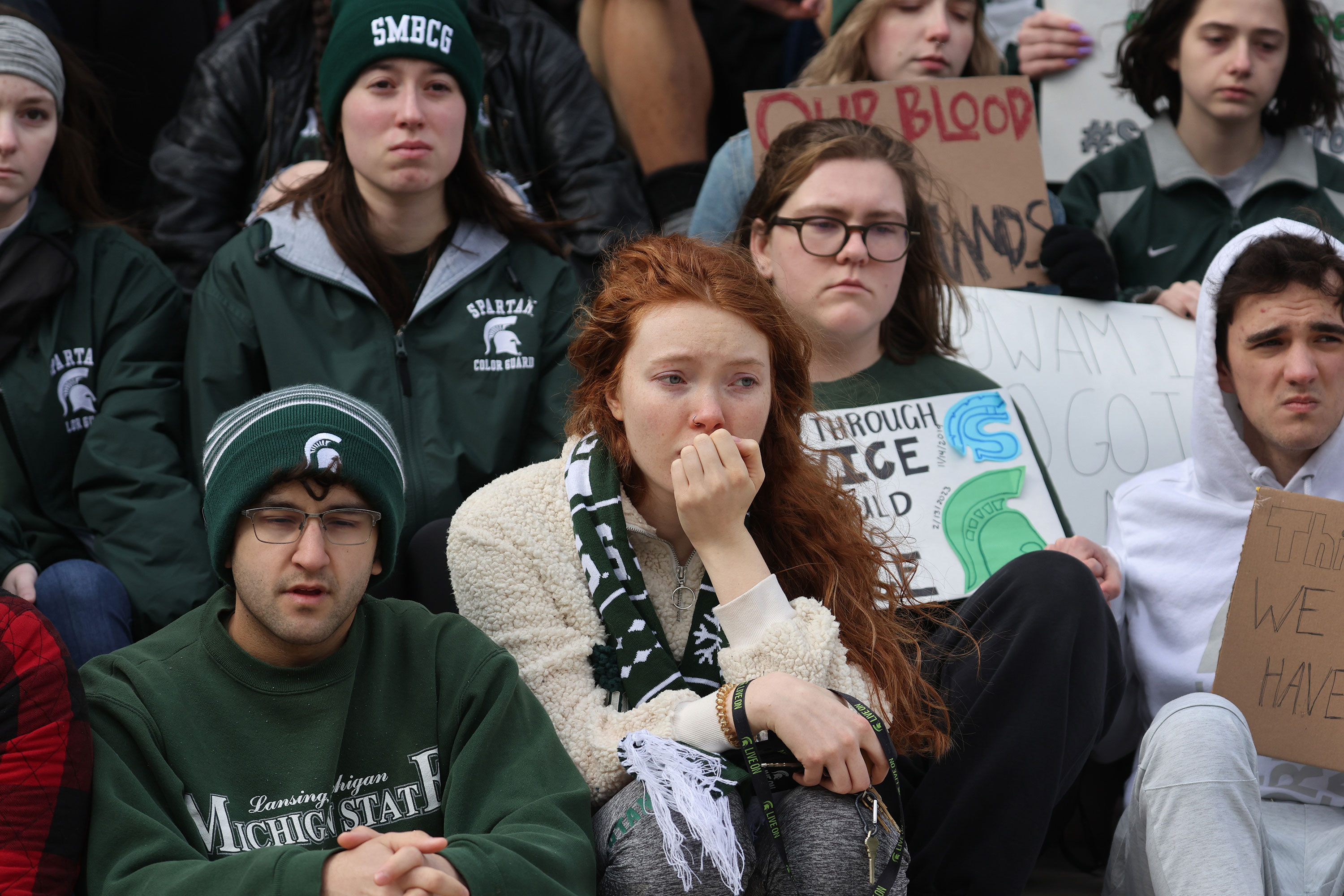 Current and former students from Michigan State University attend a rally outside of the state capitol building in Lansing, Michigan, on Wednesday.