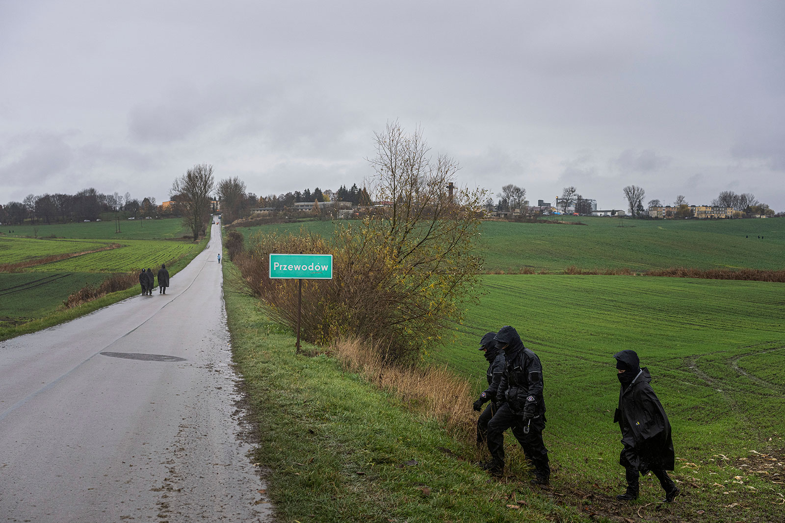 Polish police officers search for missile wreckage in a field in Przewodow, Poland, on November 16.