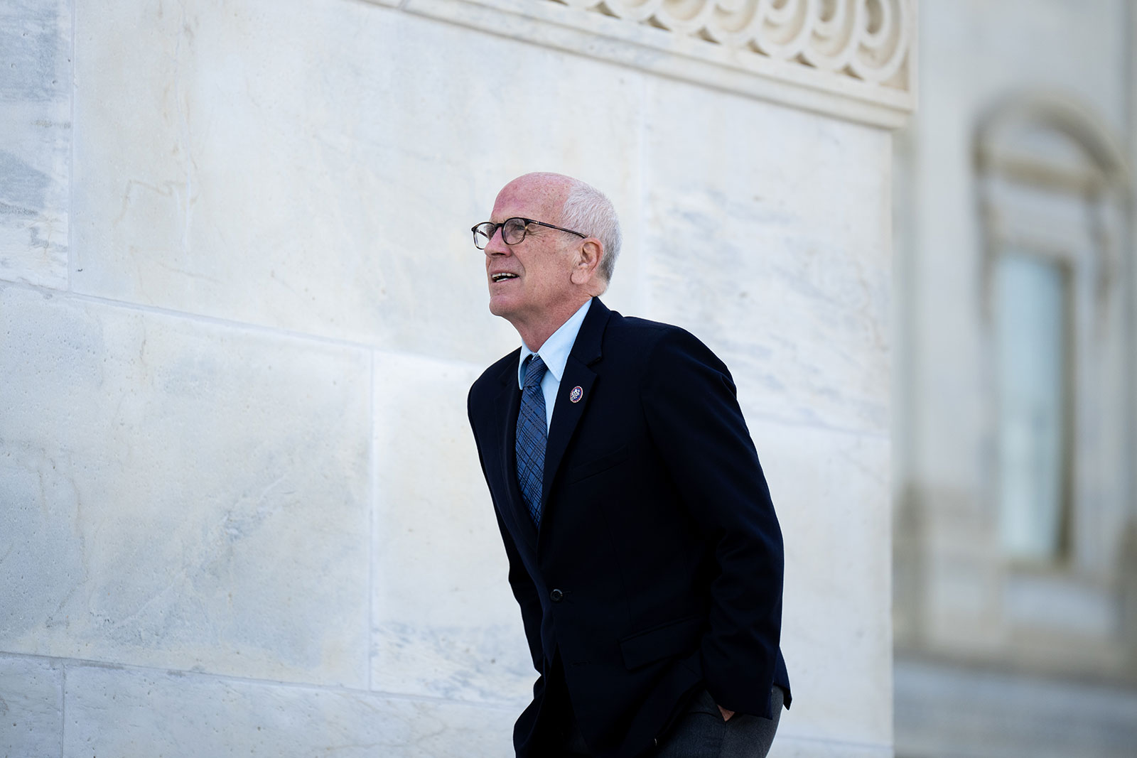 Rep. Peter Welch walks up the steps of the Capitol on April 28. 