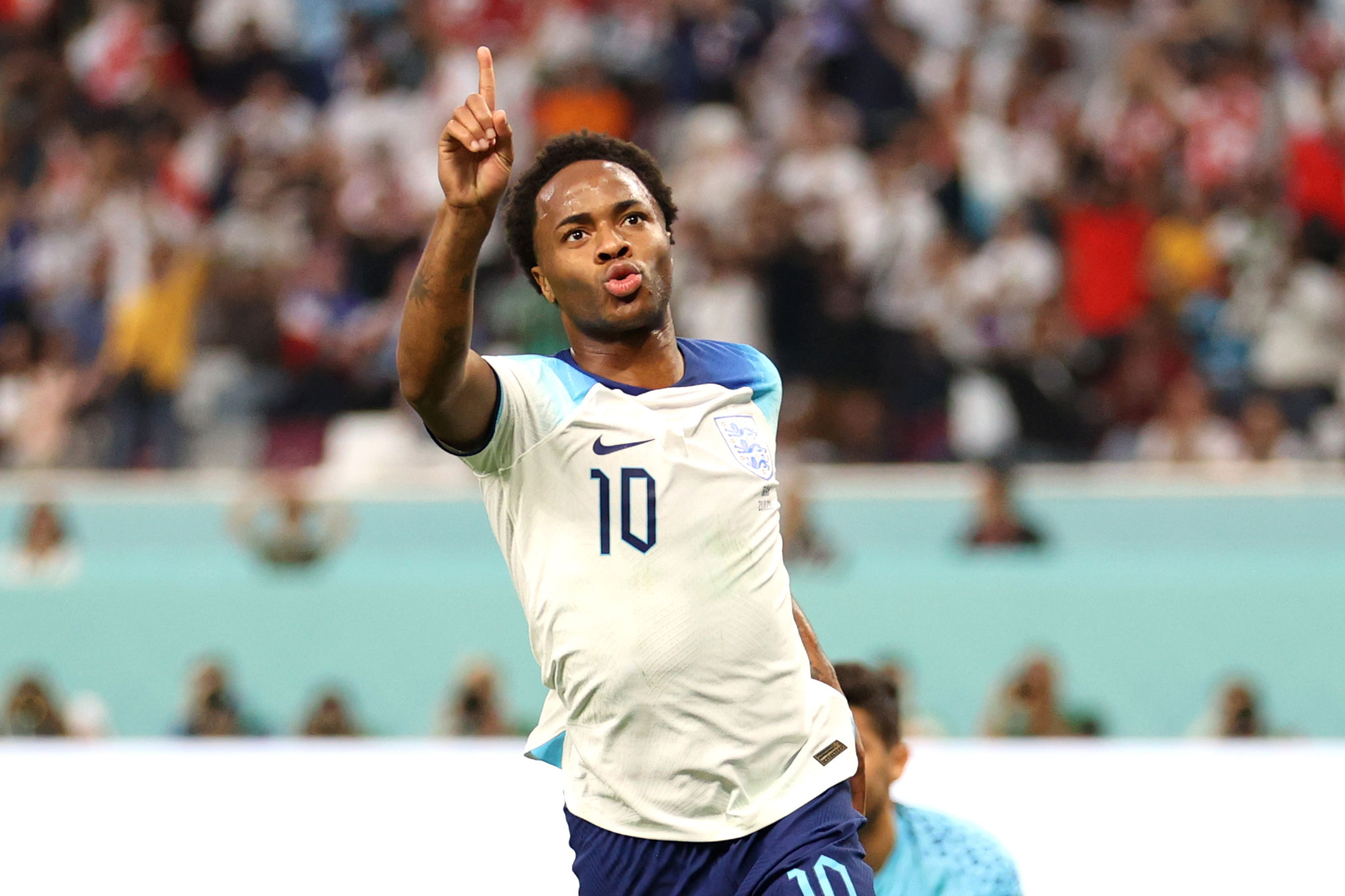 England's Raheem Sterling celebrates scoring a goal against Iran on November 21.