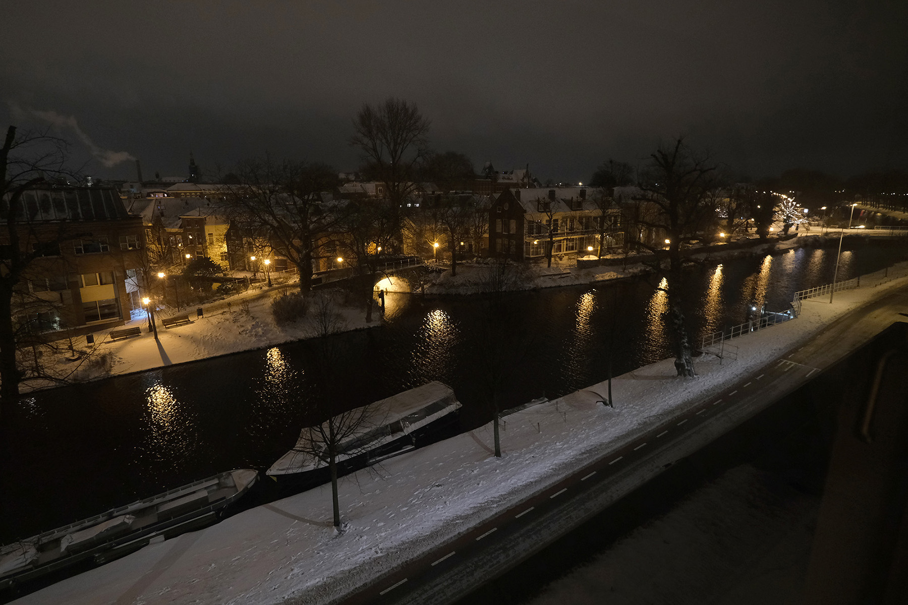 A snowy canal scene during a night curfew on February 7, 2021, in Leiden, Netherlands. 