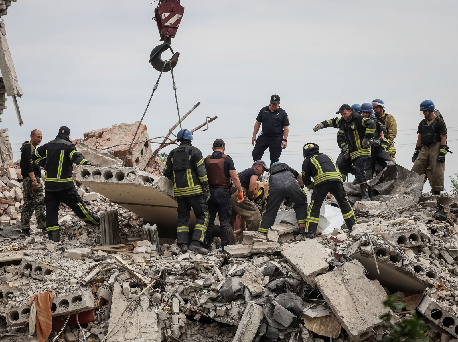 Rescuers pull a body from a residential building damaged by a Russian military strike in the town of Chasiv Yar, in the Donetsk region, on Sunday.