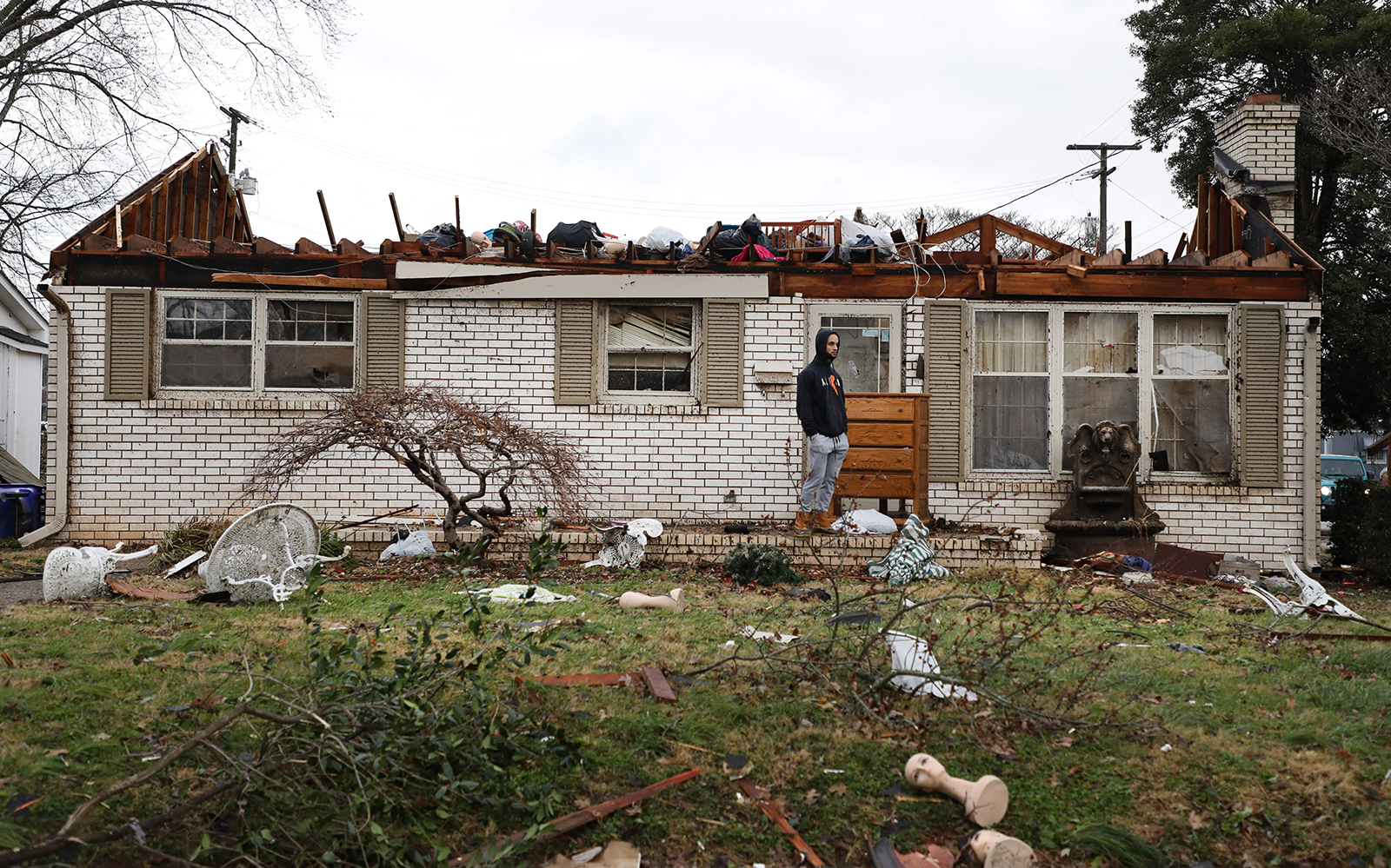 A resident in Bowling Green, Kentucky, surveys the damage after a tornado hit the area on December 11. (Gunnar Word/AFP/Getty Images)