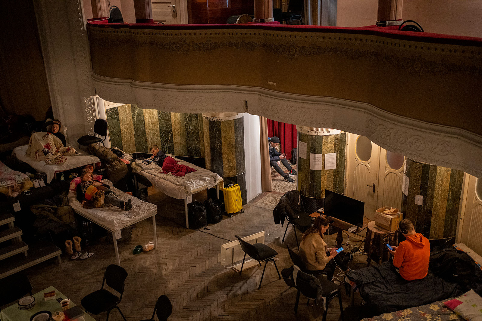 Displaced Ukrainians take shelter in an auditorium in Lviv, Ukraine, on March 2. 