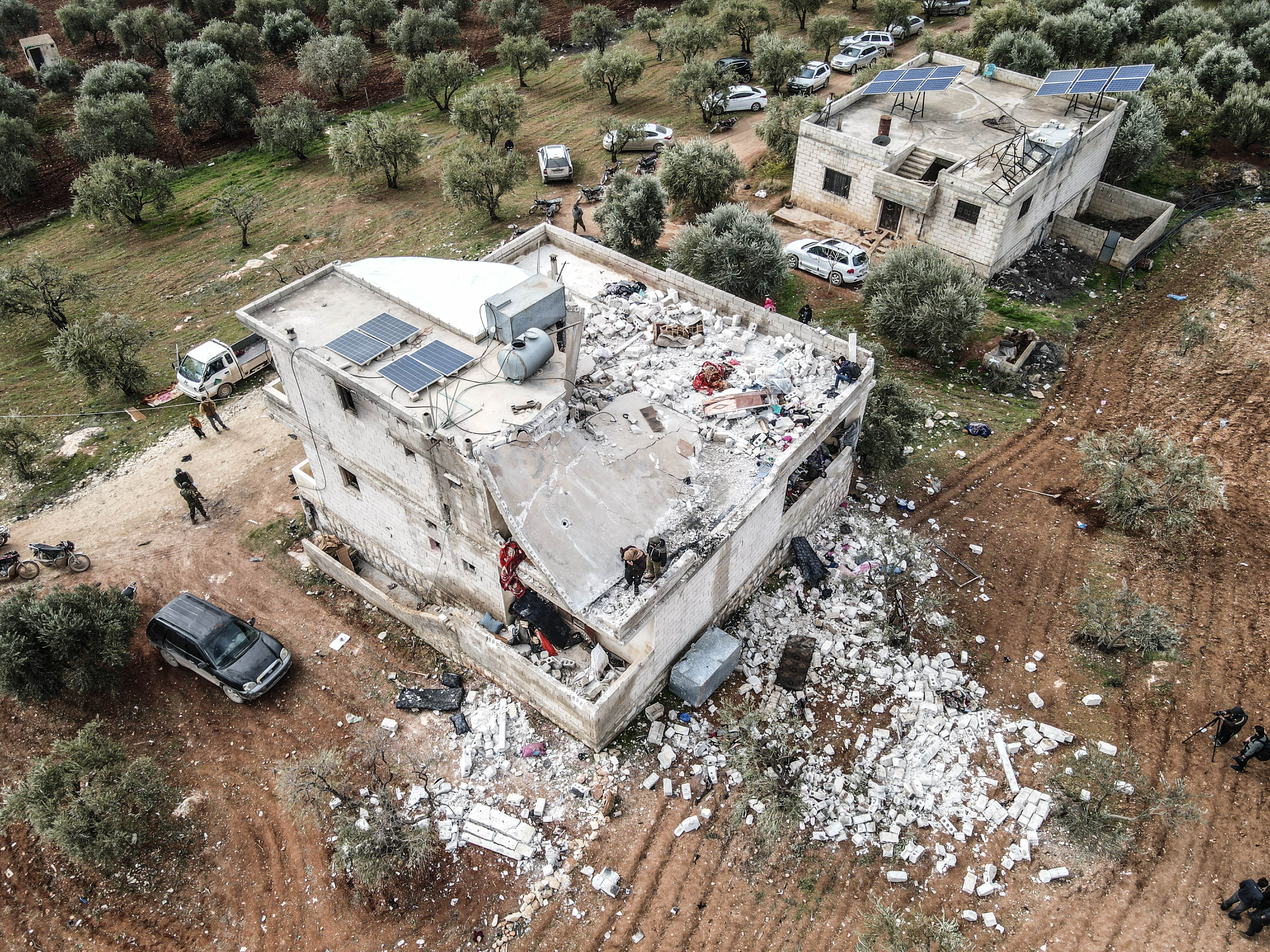 An aerial view of wreckage around the site after an operation carried out by US forces on February 3 in Idlib, Syria.